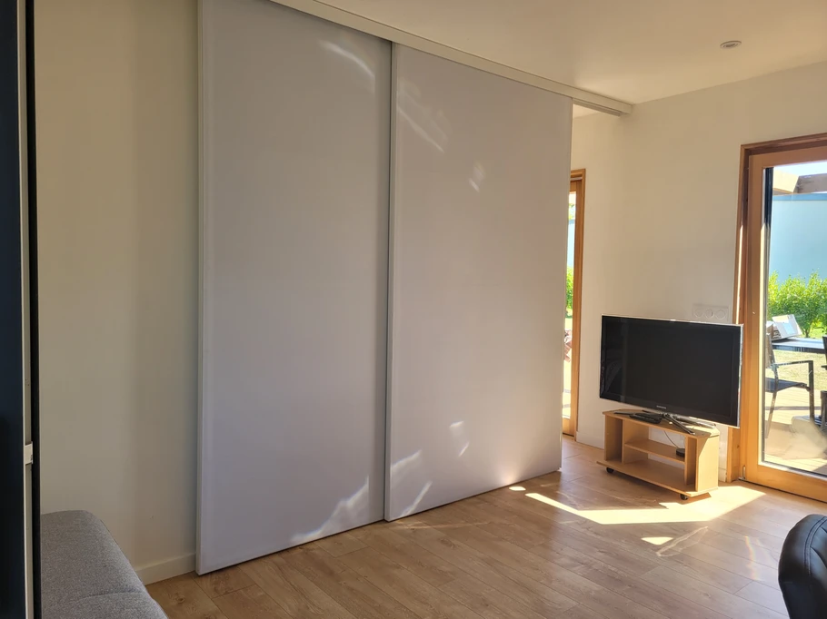 Palluel, Clévacances holiday let in Plourhan, living area with a removable partition between the living room and the bedroom area