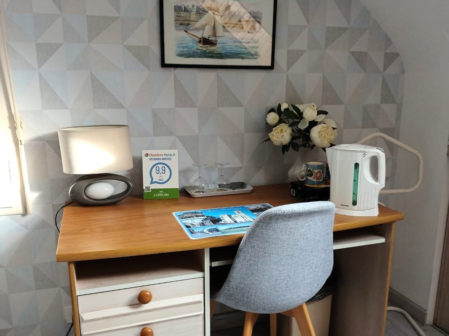 Bedroom 1 - 140 x 190 cm bed with desk, kettle and tea set, TV, wardrobe and chest of drawers.