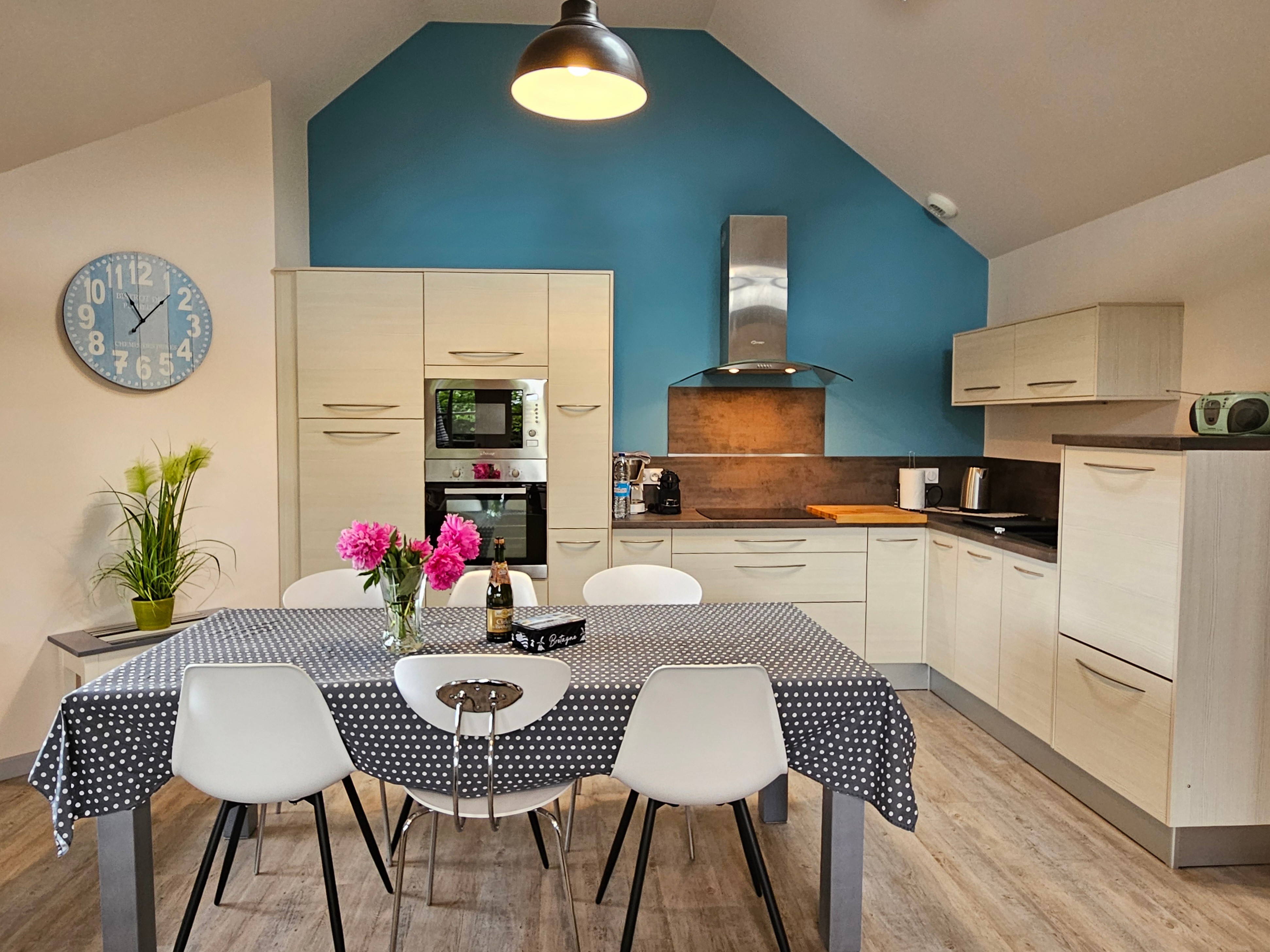 Living room with fitted kitchen, lounge and sitting area. Access to private terrace.