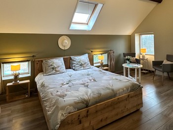 the bedroom with its large bed