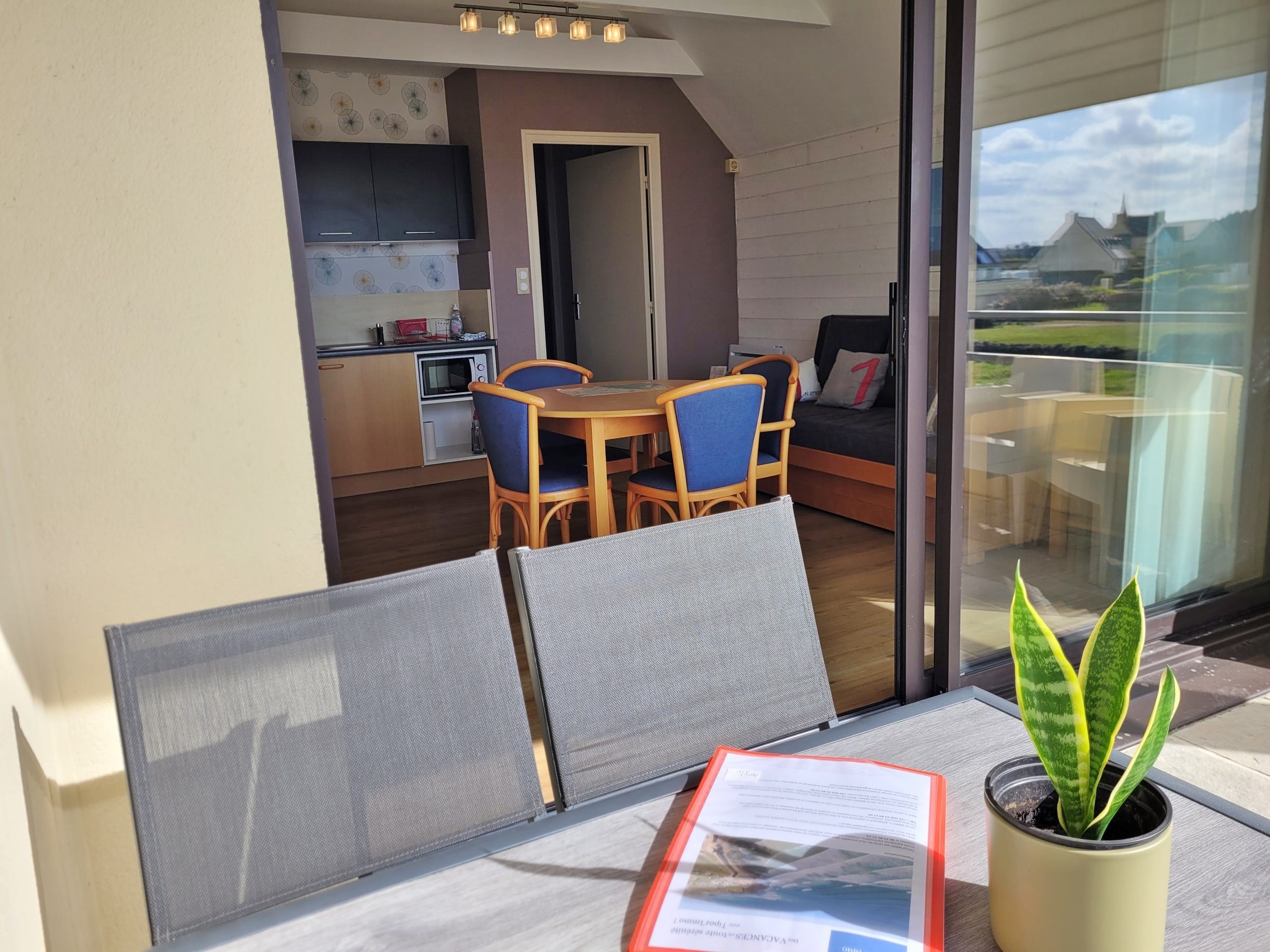 Balcony with sea view and garden furniture