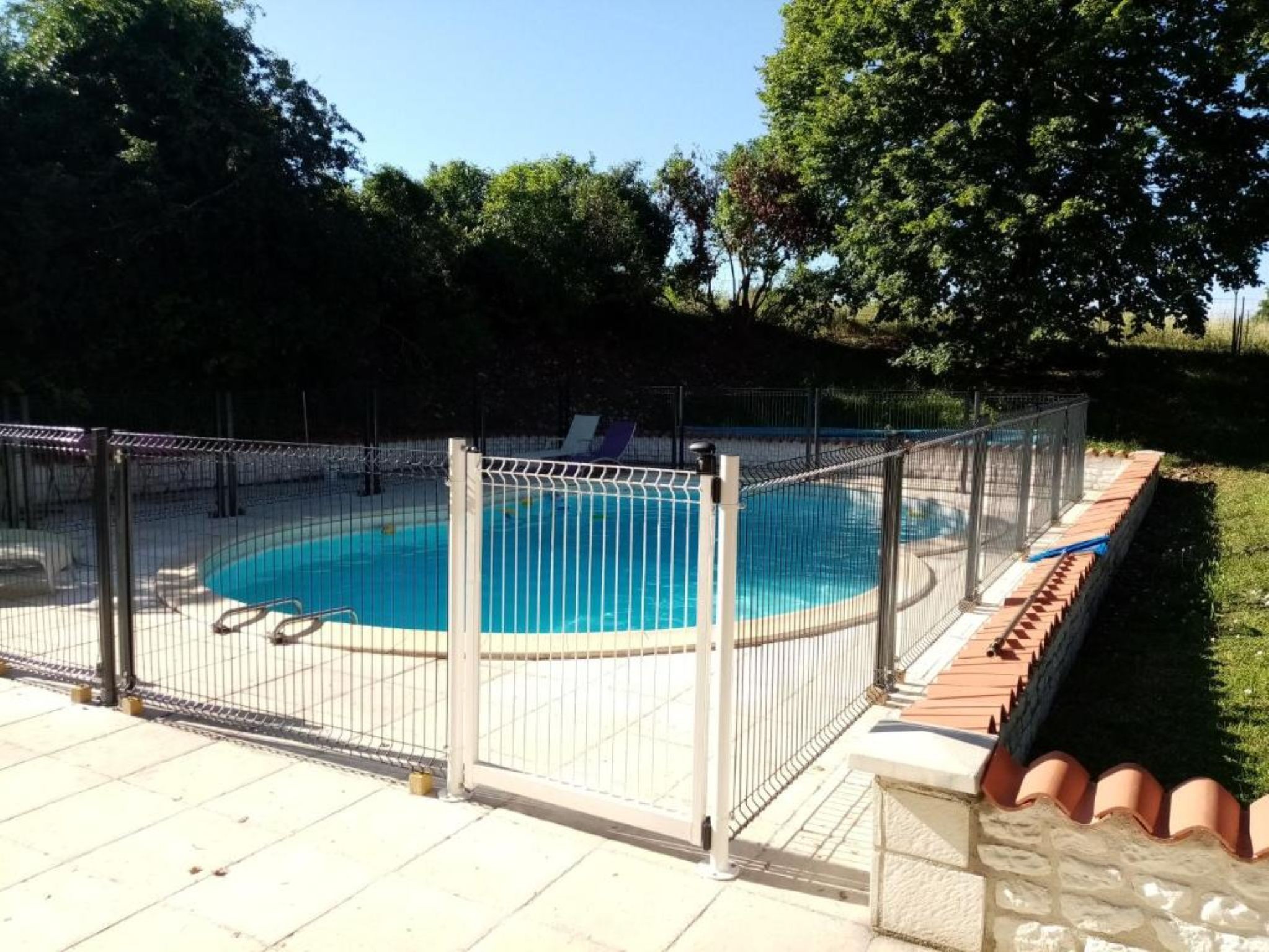 Shared, secure swimming pool at Les Ormes de Belluire property in Charente maritime