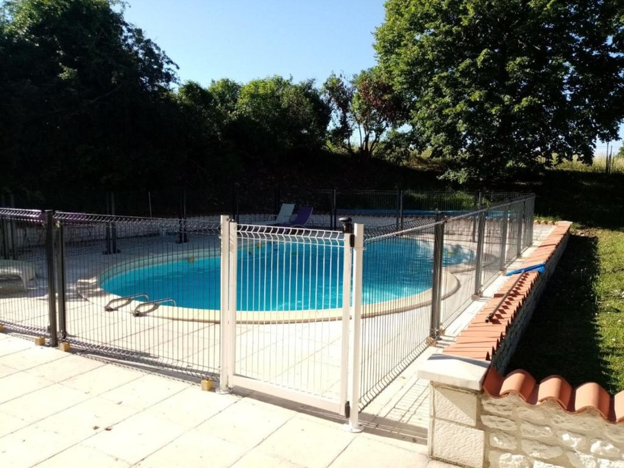 Shared, secure swimming pool at Les Ormes de Belluire property in Charente maritime