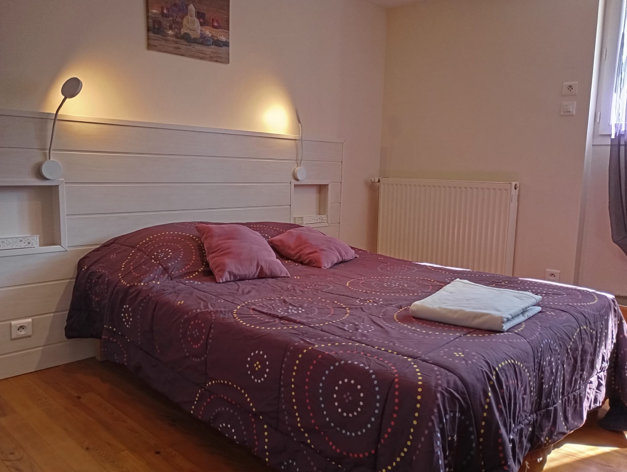 1st bedroom with 1 double bed and 2 bunk beds overlooking the courtyard