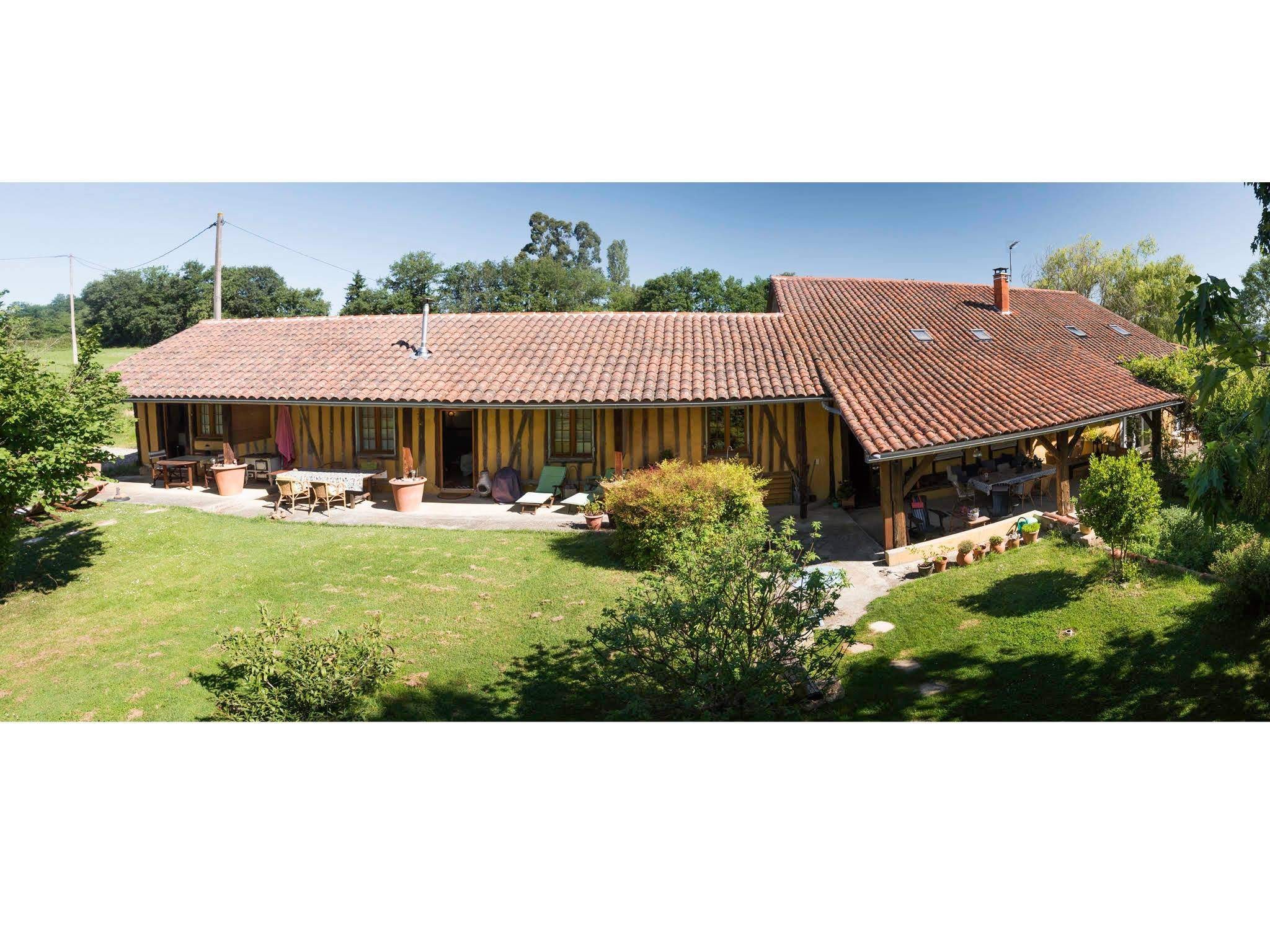 Aerial view of the entire house with the family room on the left
