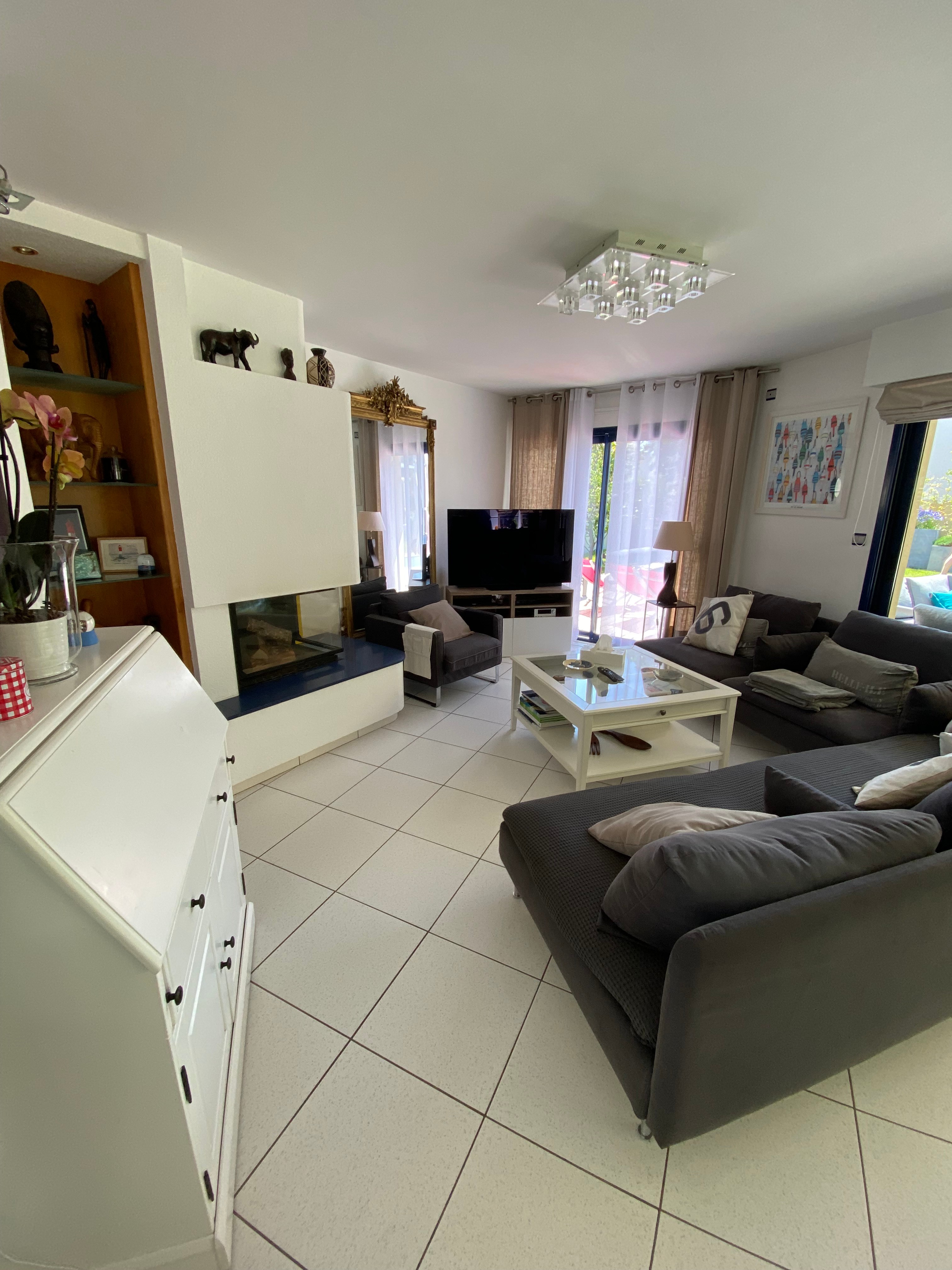Living room with a TV and a fireplace
