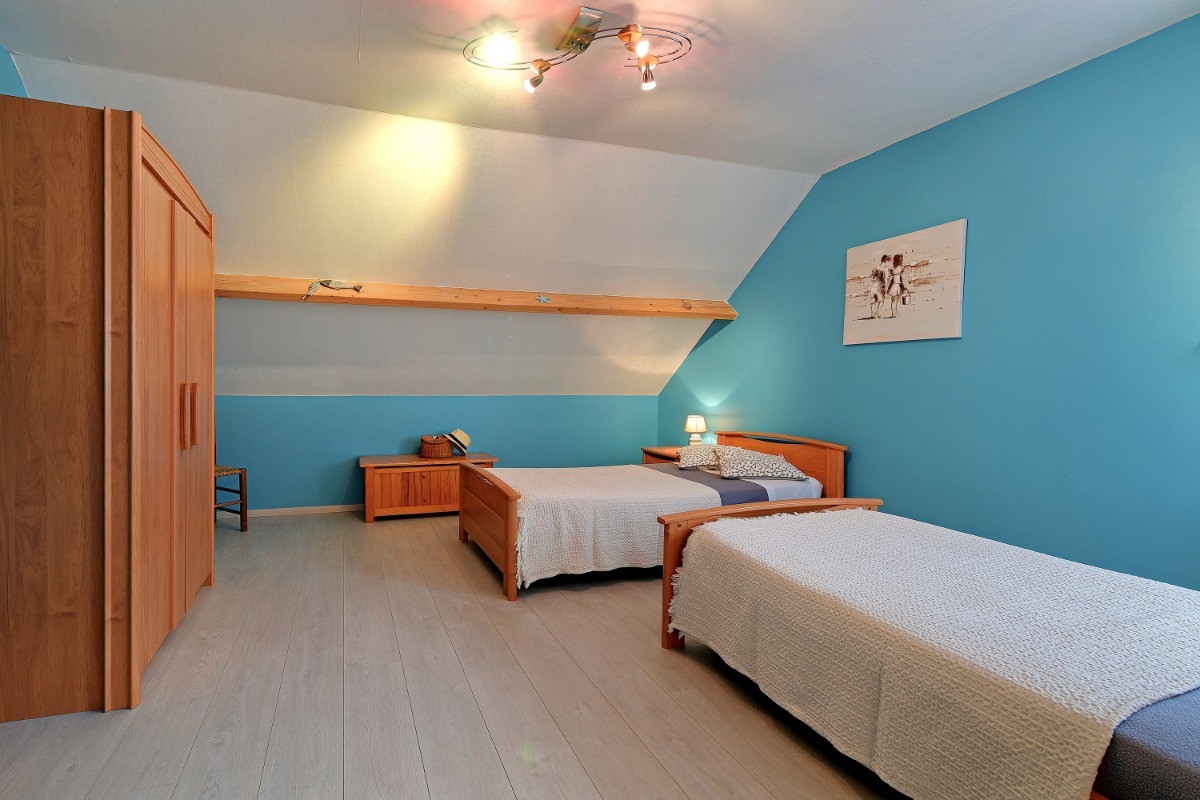 La chambre bleue à l'étage