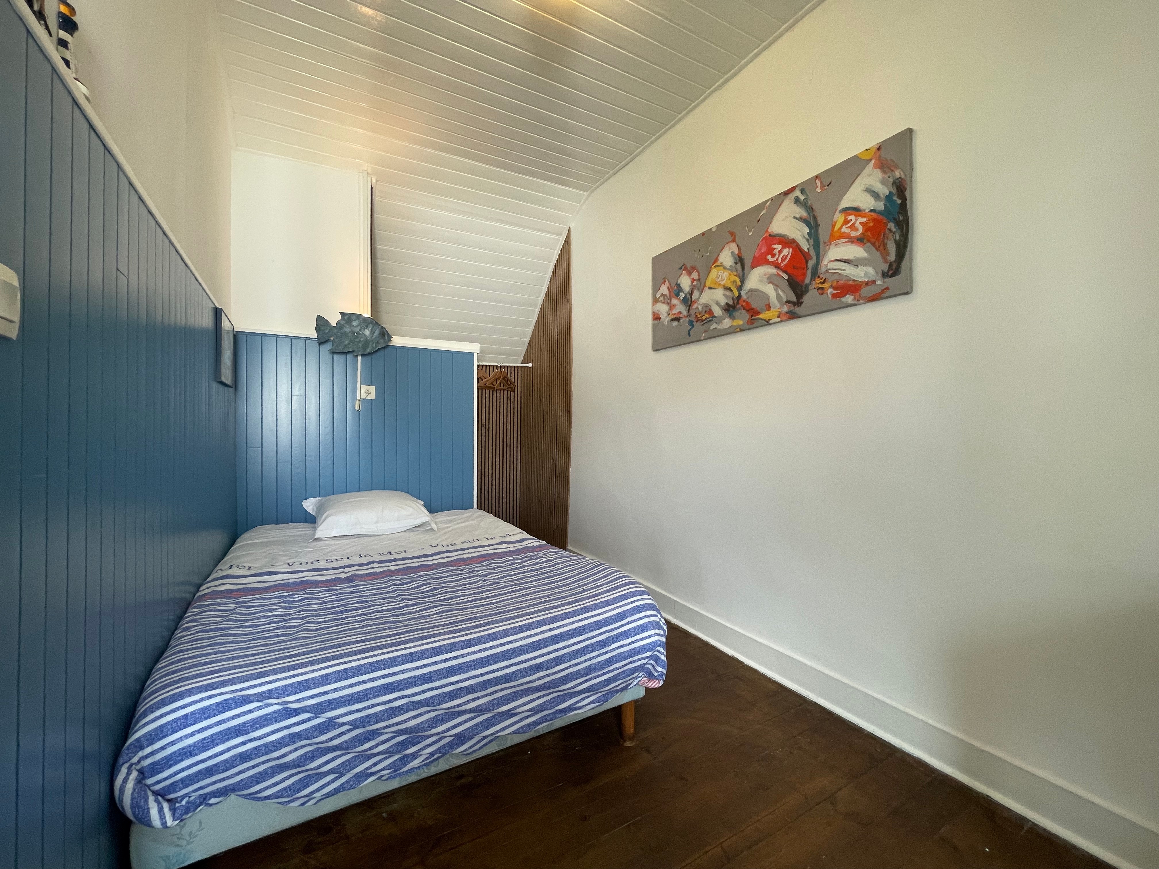 Upstairs is a bedroom with a 120cm single bed.
