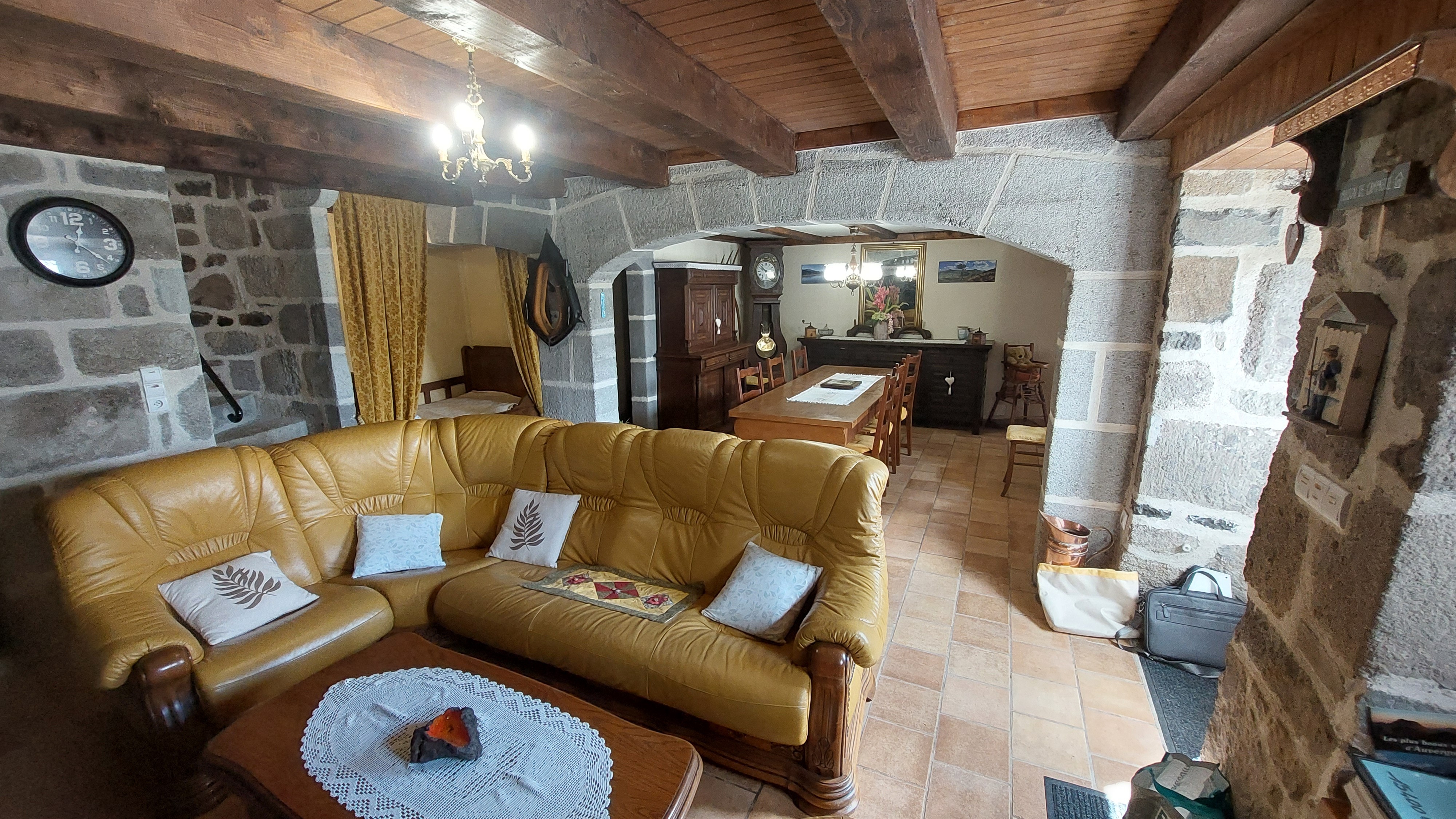 Authentic living room with stone walls and comfortable sofa