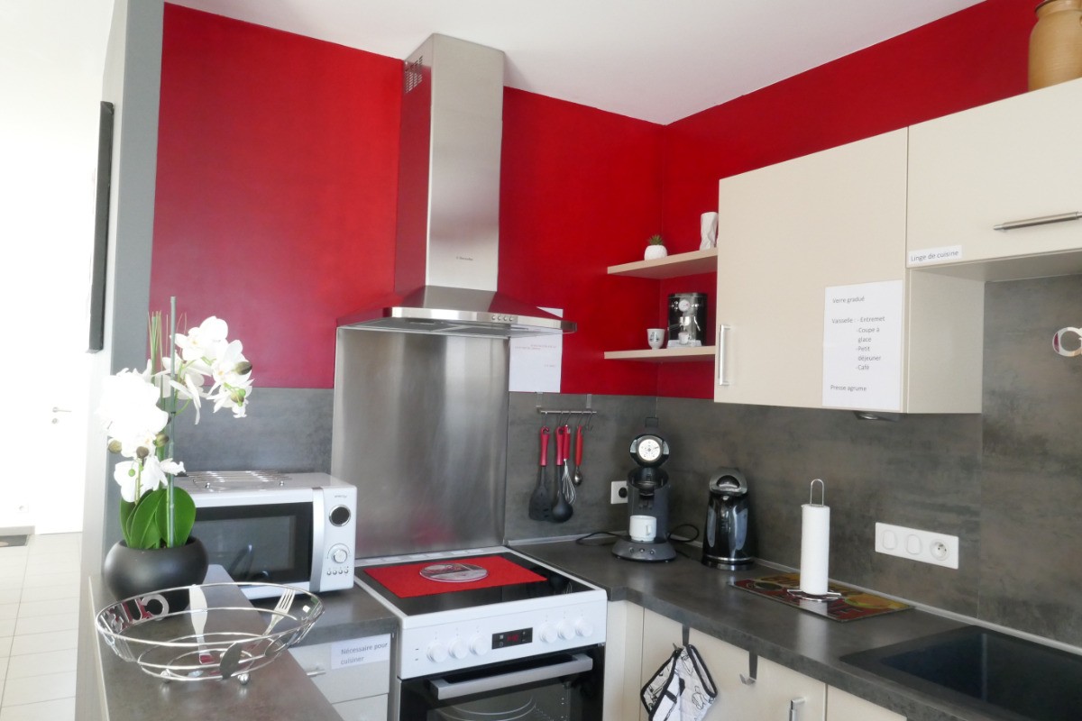 Kitchen opening onto living room