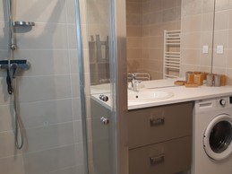 Shower room with washing machine