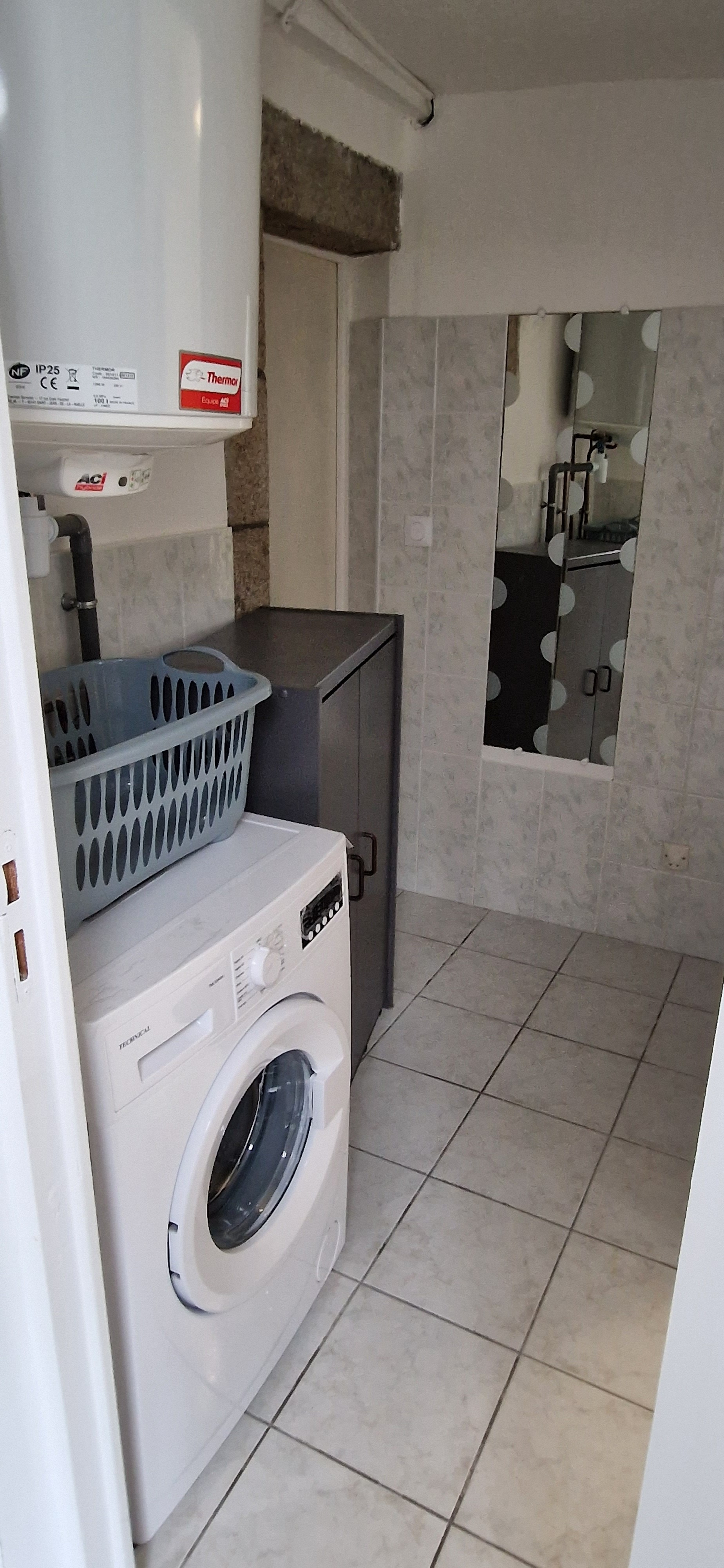 coin machine à laver au RDC