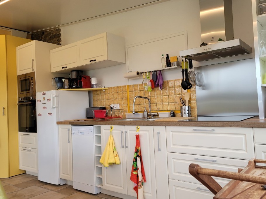 Cuisine-séjour plan de travail dans véranda