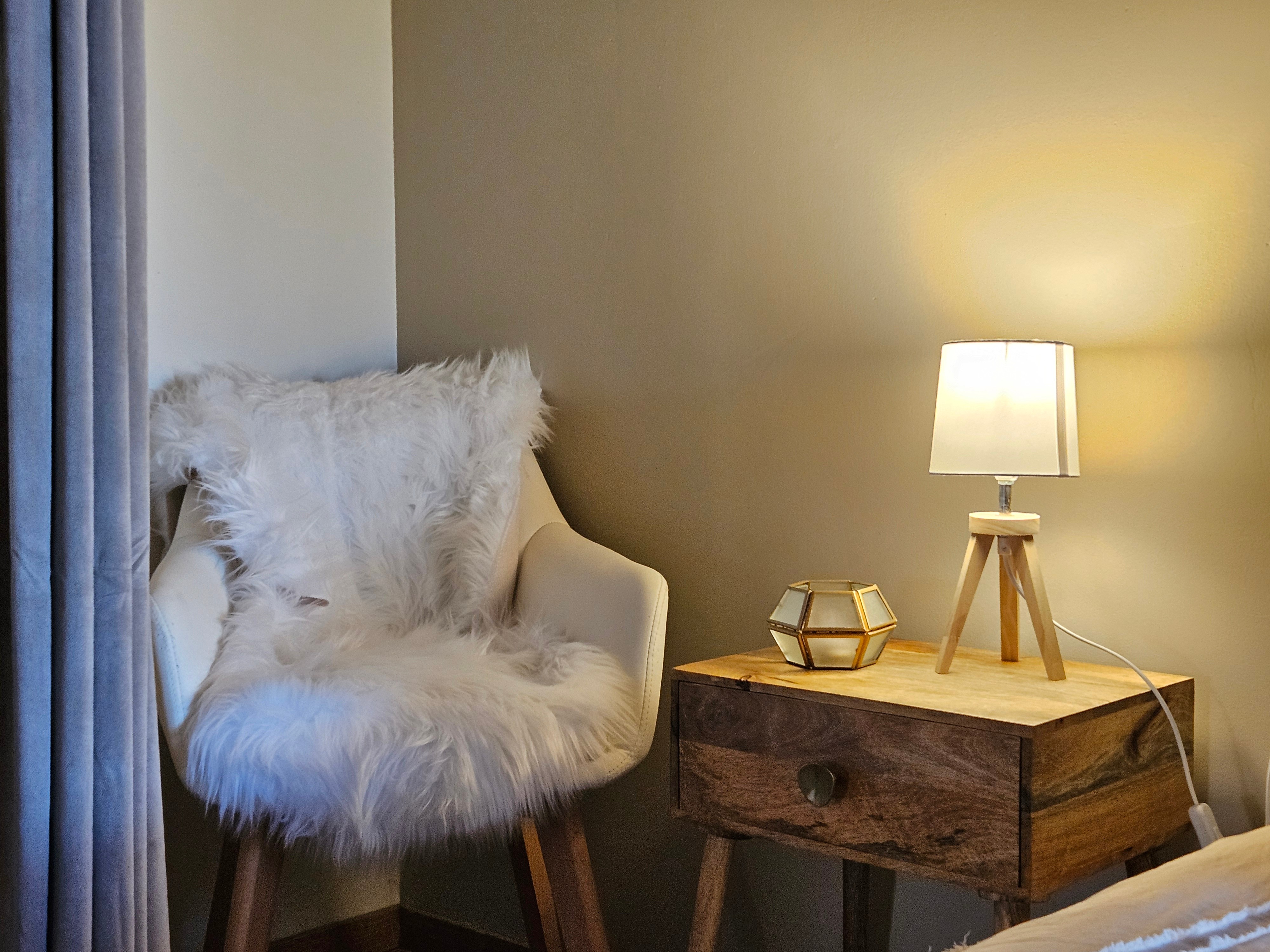 A large double bedroom with a walk-in wardrobe and a desk.