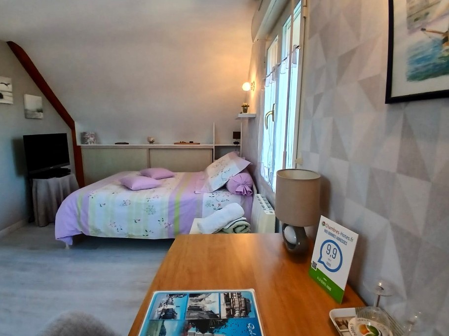 Bedroom 1 - 140 x 190 cm bed with desk, kettle and tea set, TV, wardrobe and chest of drawers.