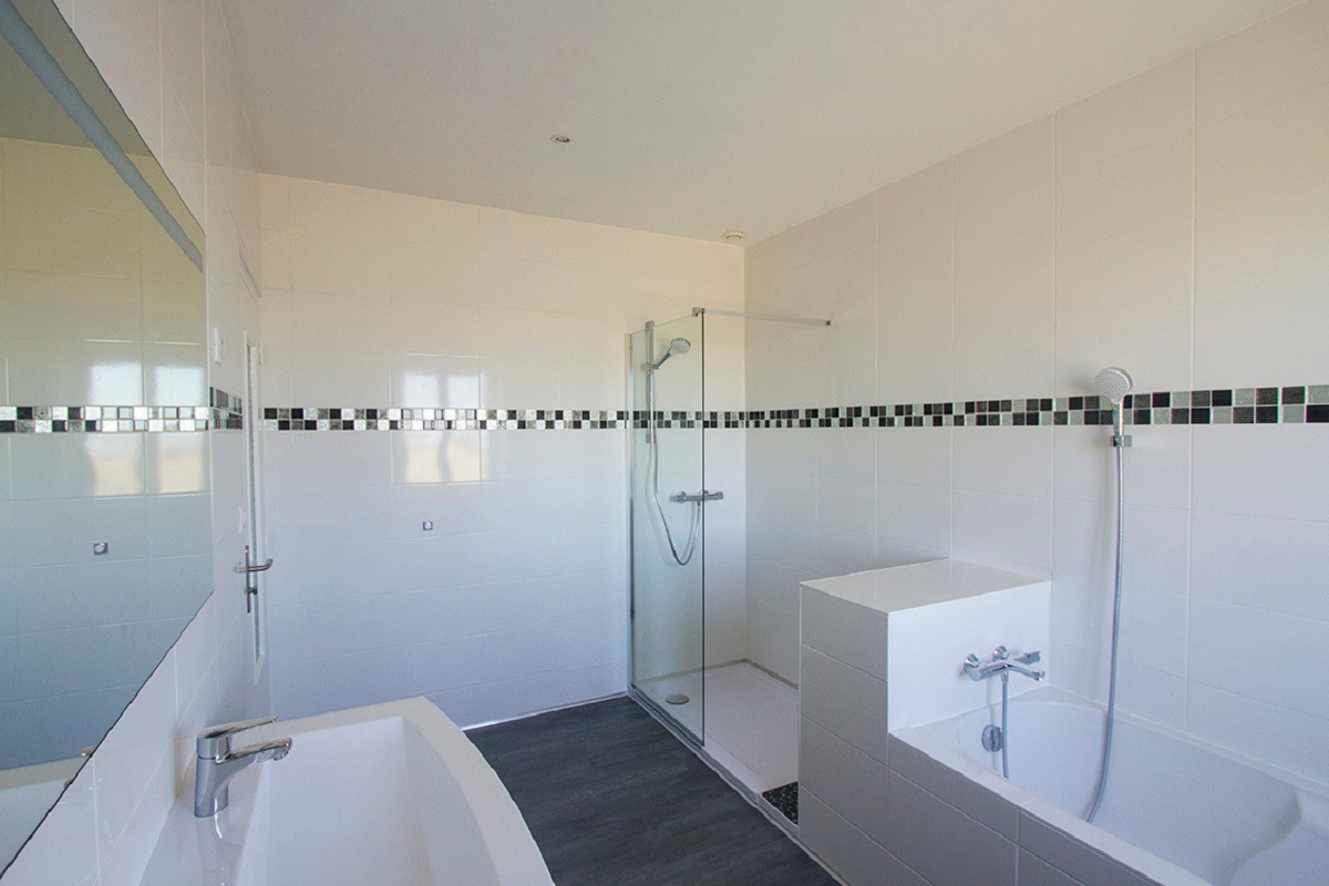 bathroom with bath and shower