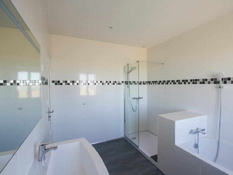 bathroom with bath and shower