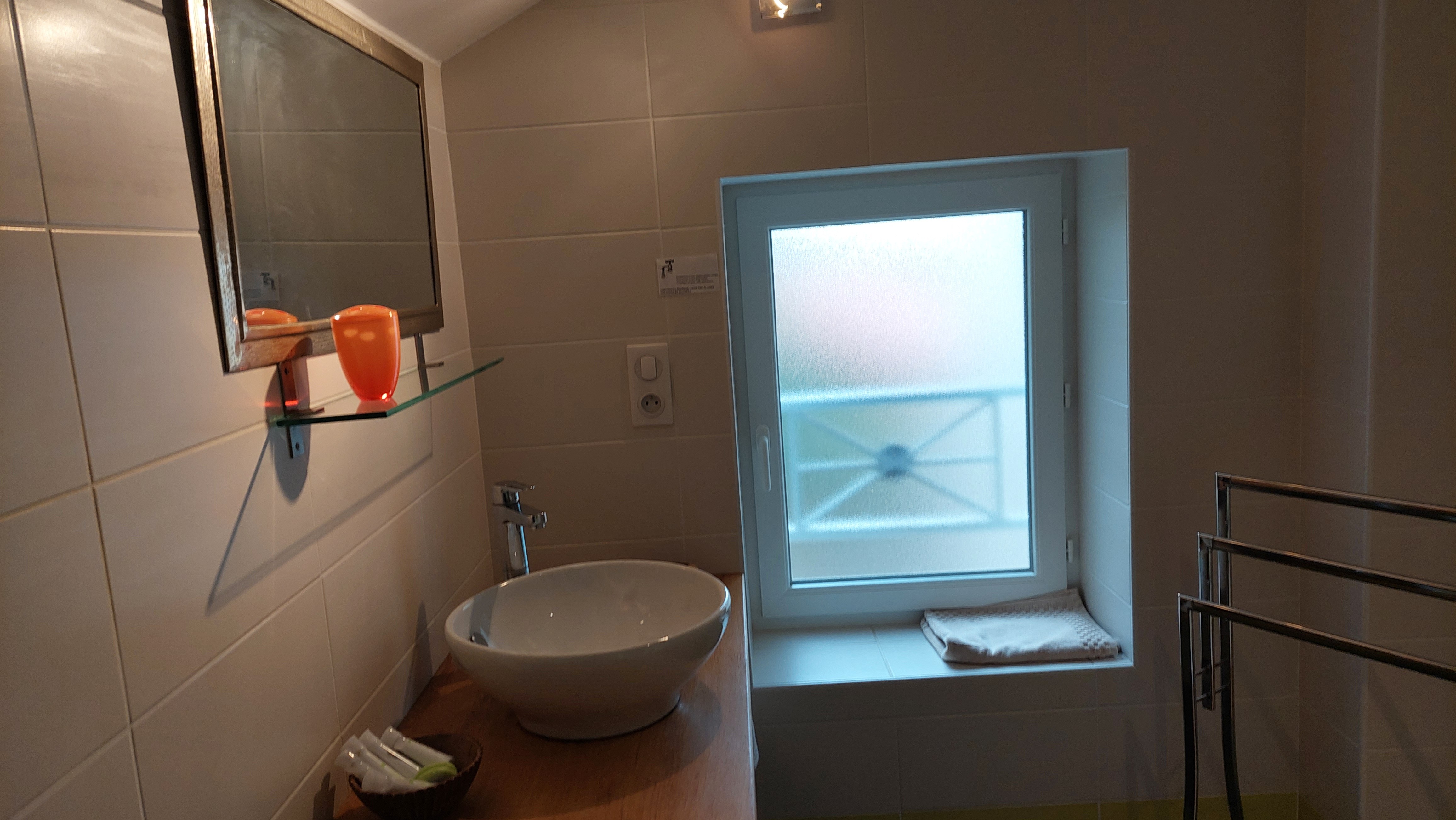bright bathroom with modern basin Cantal gîte