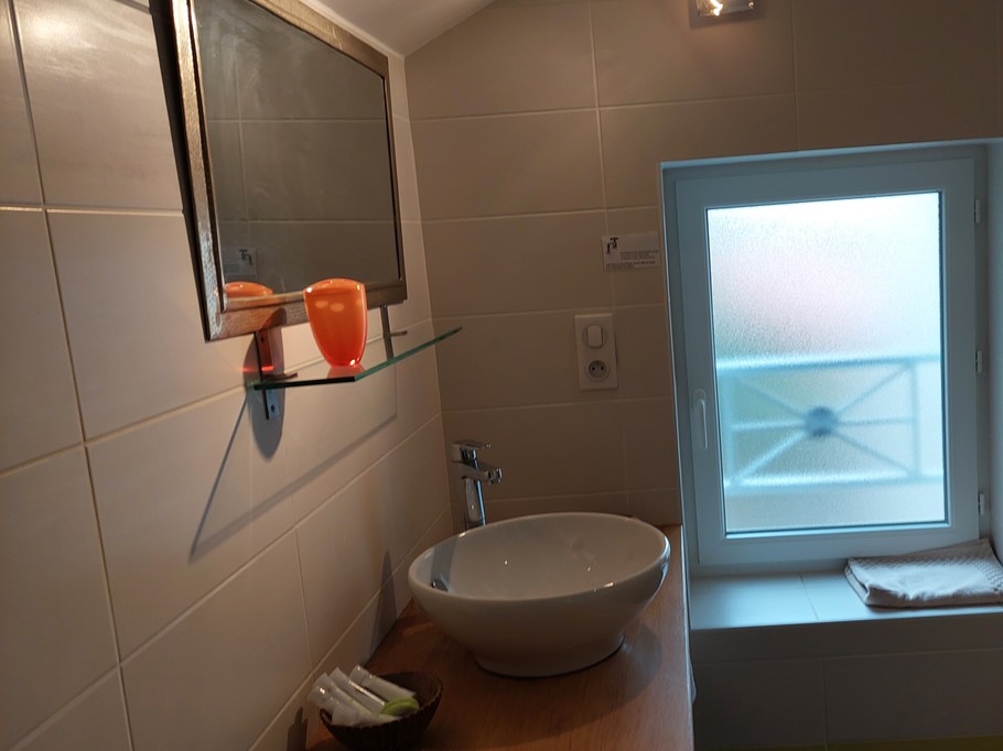 bright bathroom with modern basin Cantal gîte