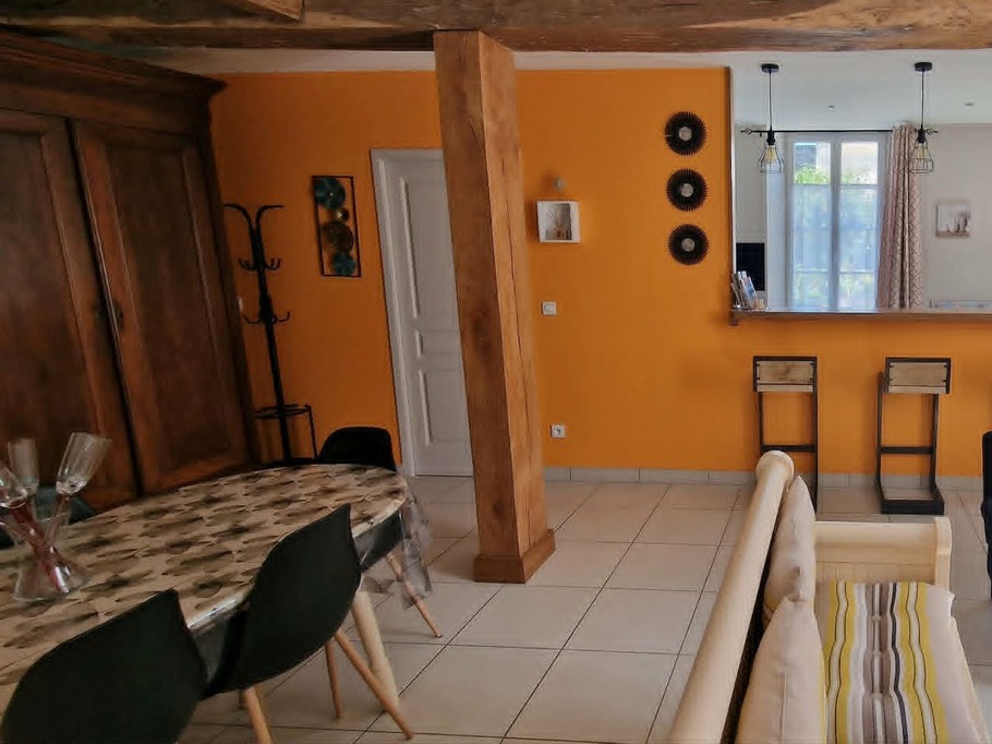 The 30 m² living room with fitted kitchen, lounge and dining area at Logis de La Passerelle in Port d'Envaux, Charente maritime.