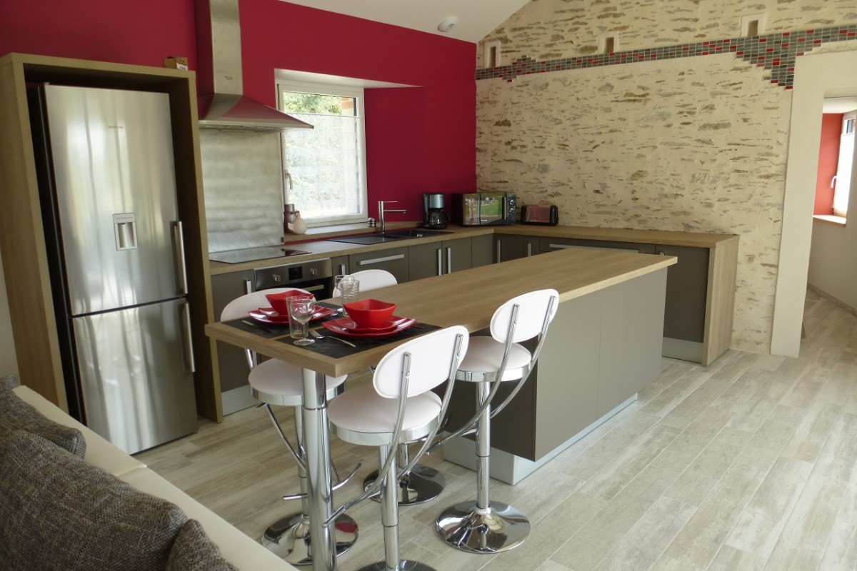 Living room with fully equipped kitchen.