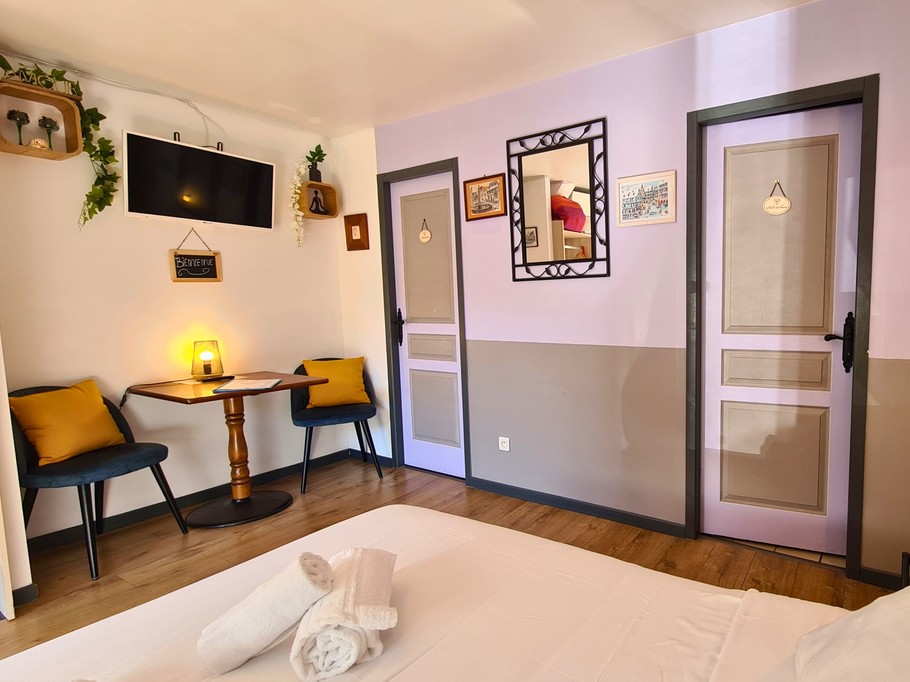 view of the bedroom and small sitting area