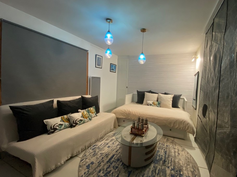 Living room in bedroom mode 3. Japanese panels made from the mainsail of Jean LE CAM's boat.