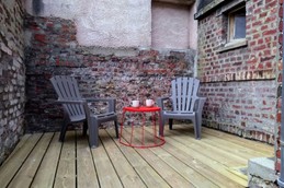 A terrace adjoining the kitchen, in an enclosed courtyard, gets plenty of morning sun.