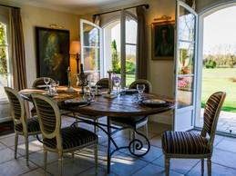 Open-plan dining room with golf view