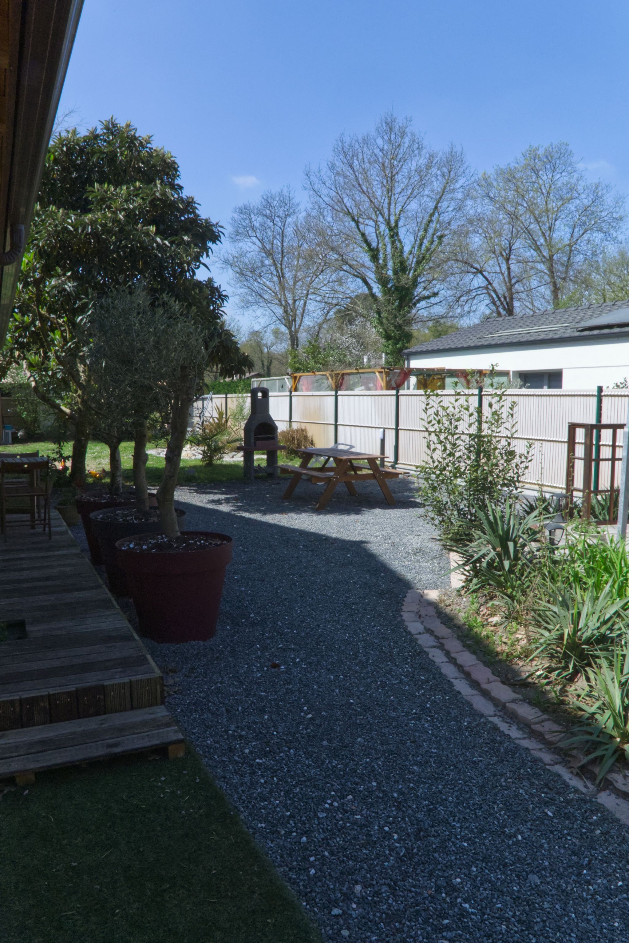 View of the garden at Villa Primevères, which sleeps 6, in Gironde