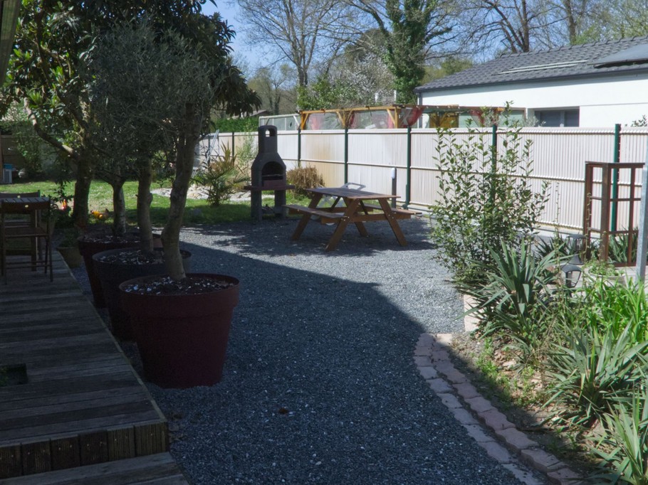 View of the garden at Villa Primevères, which sleeps 6, in Gironde