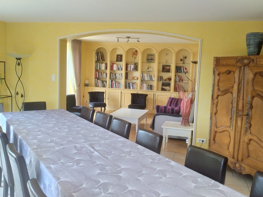 Dining room and 2nd lounge/library area in the background