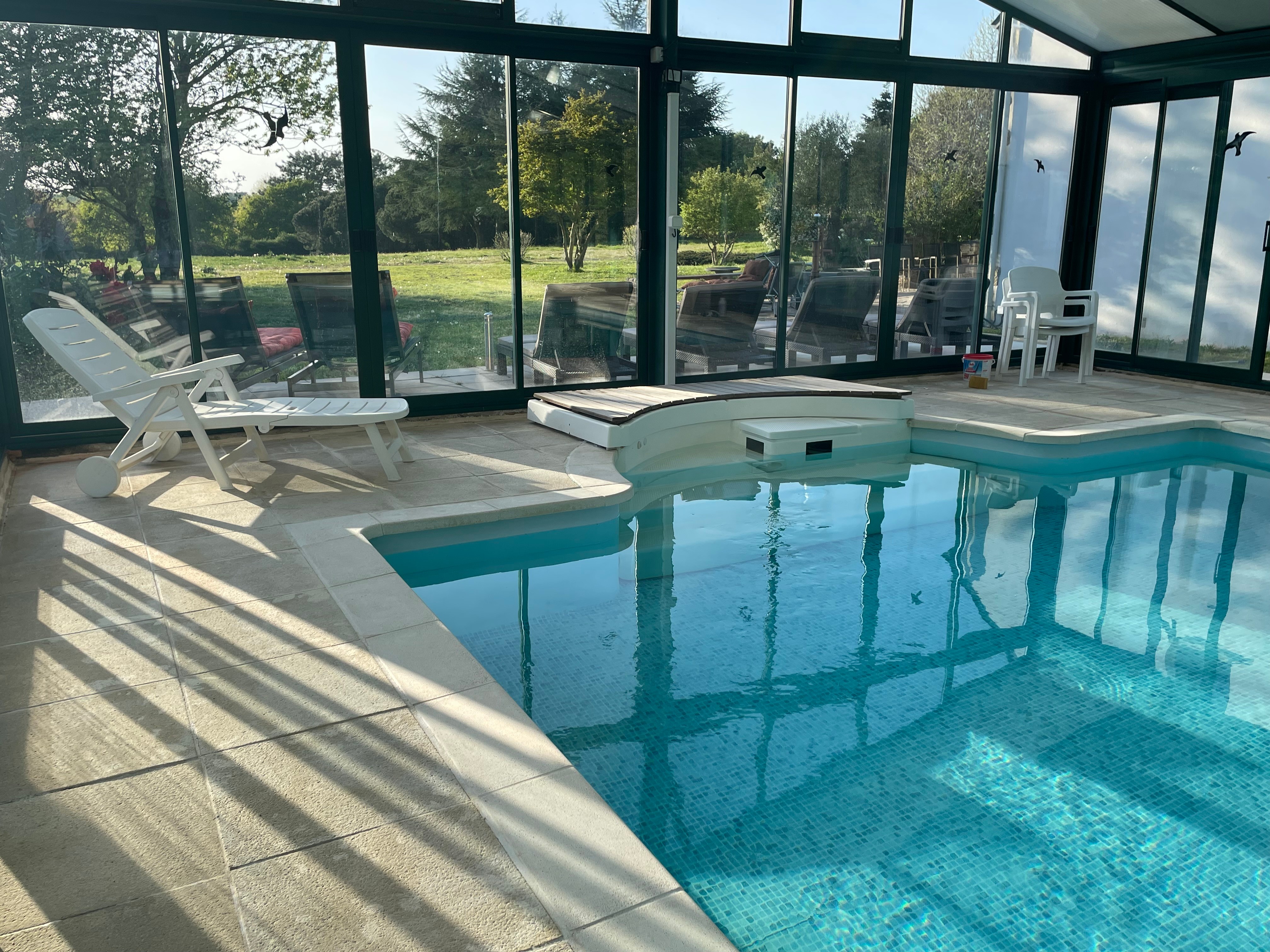 Heated indoor swimming pool overlooking the park