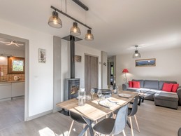 Living room and lounge with a wood-burning stove