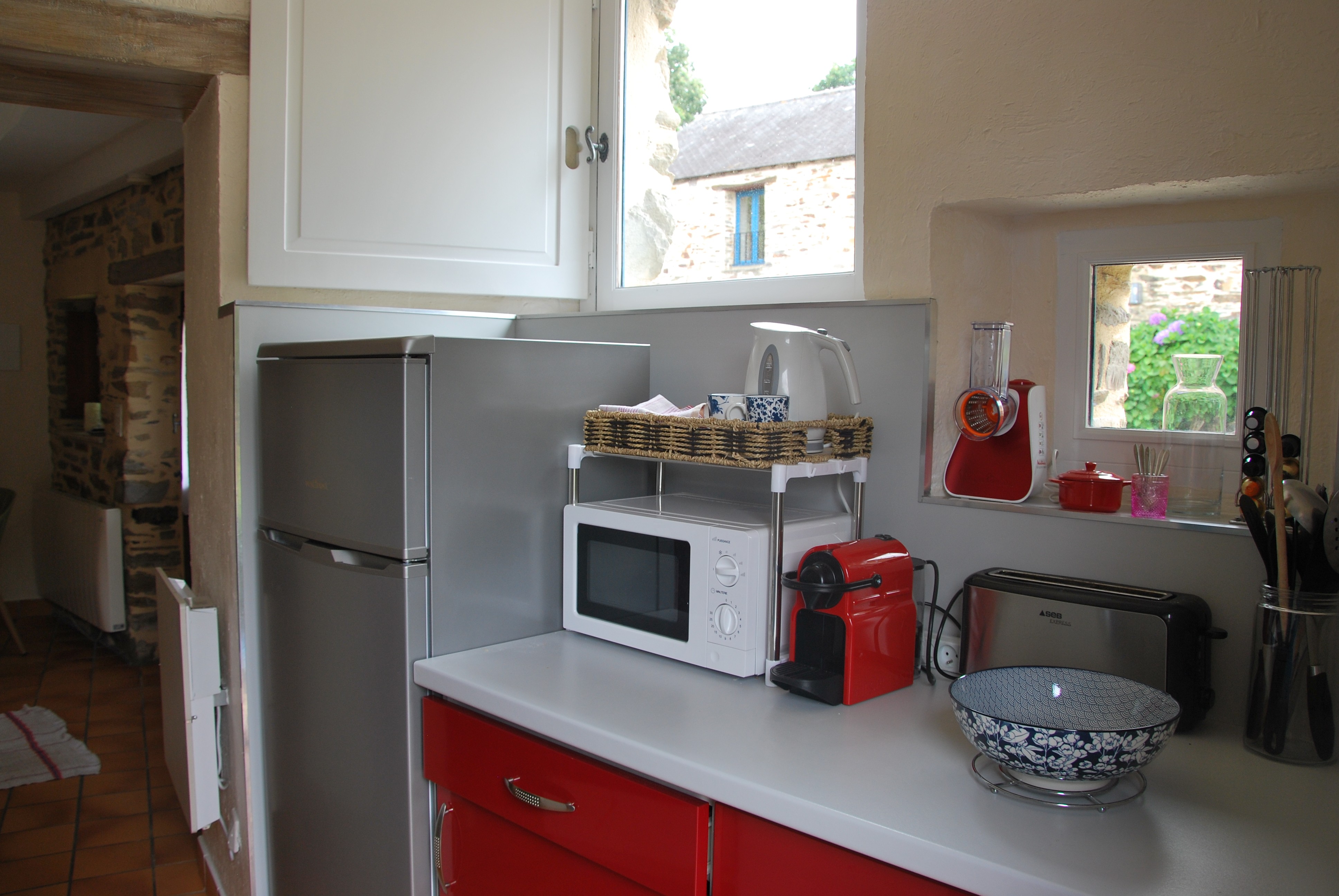 Kitchen opening onto terrace
