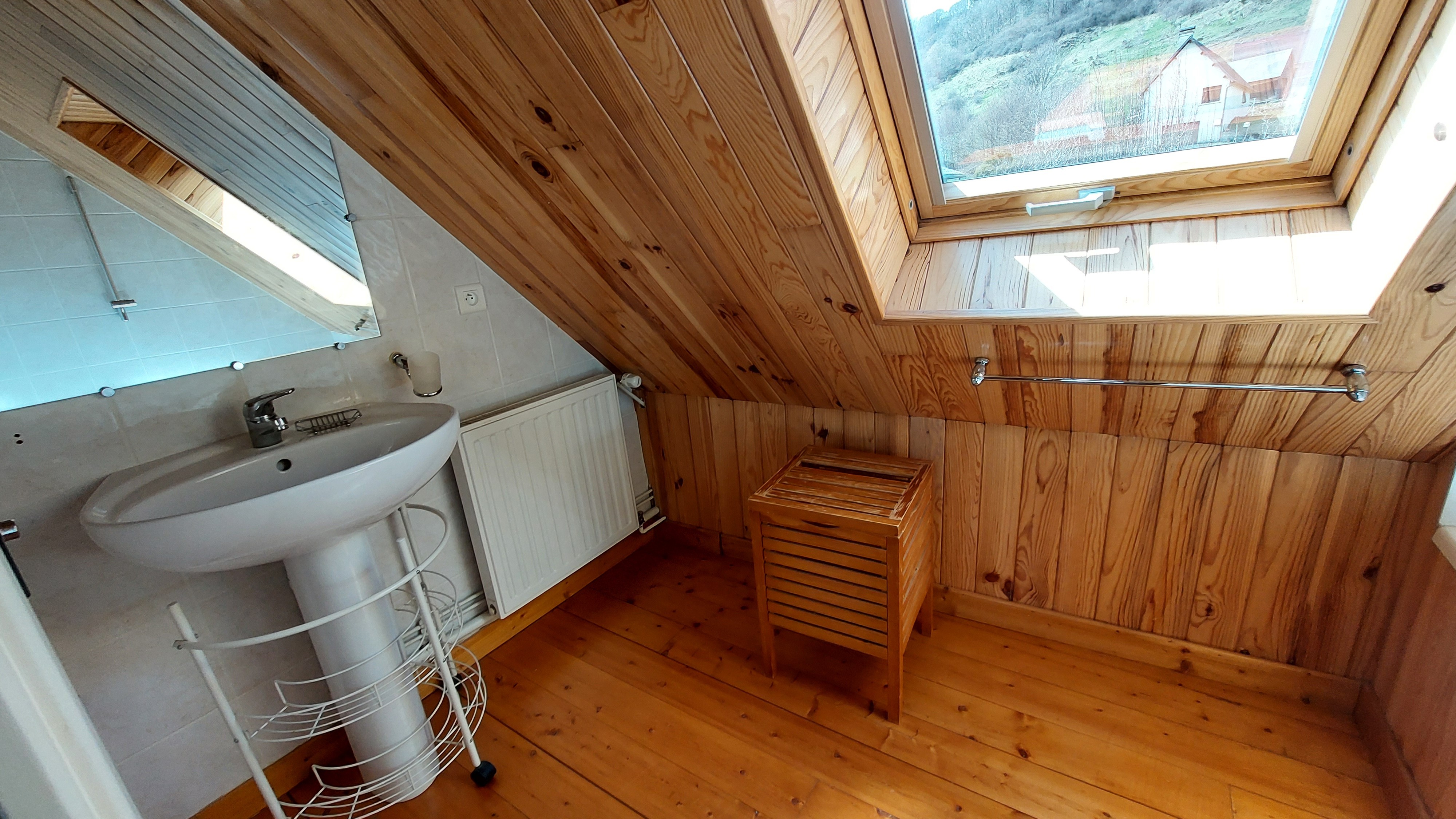 Attic bathroom with bath