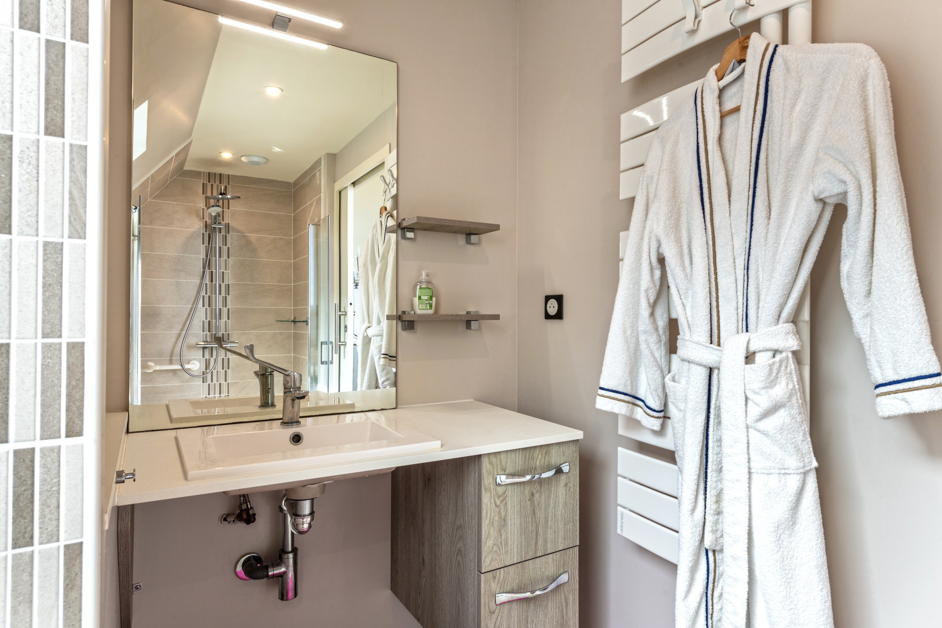 White bathroom with walk-in shower and WC