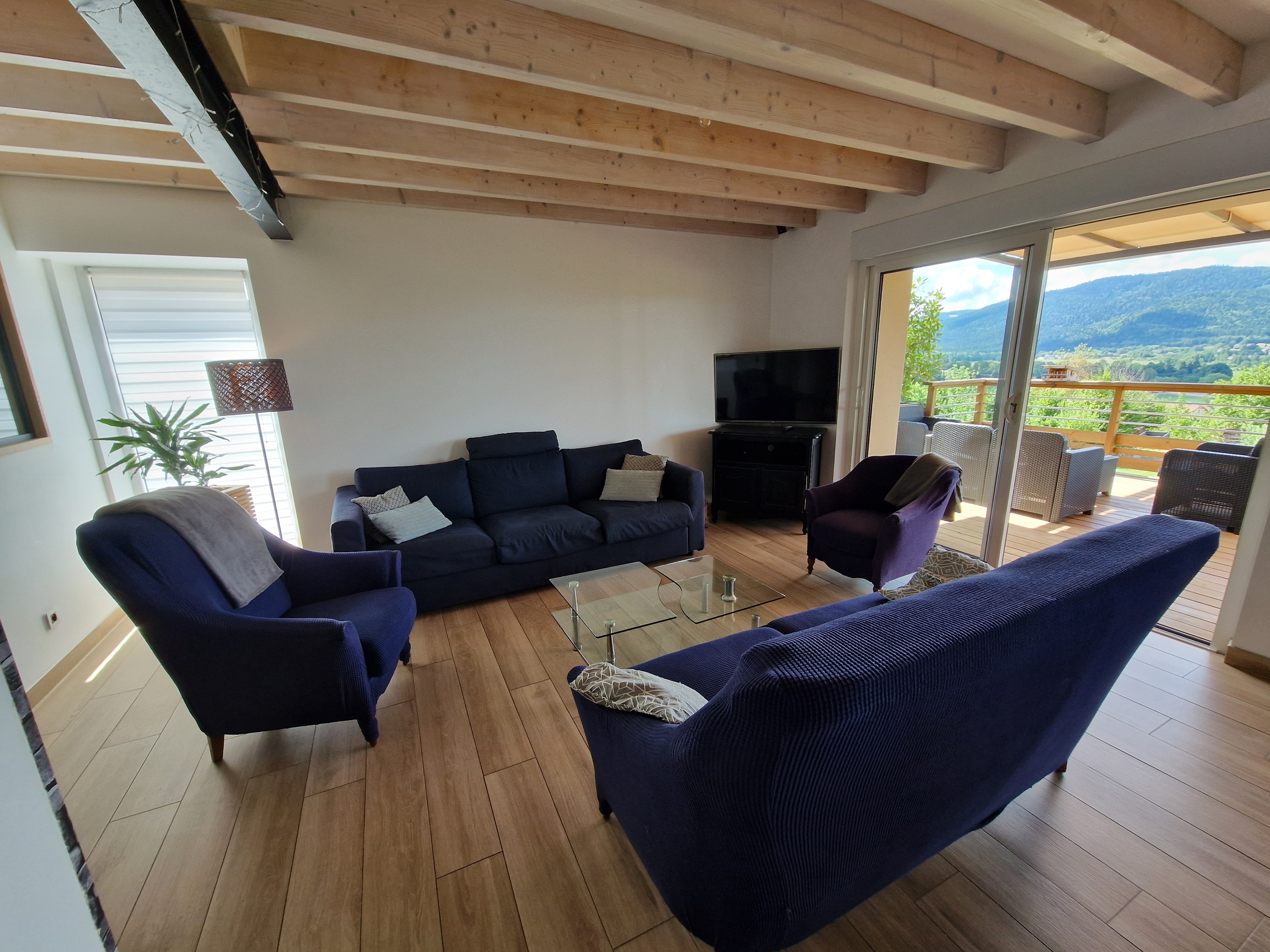 Living room opening onto the terrace and the countryside – FEING DES LOGES holiday cottage