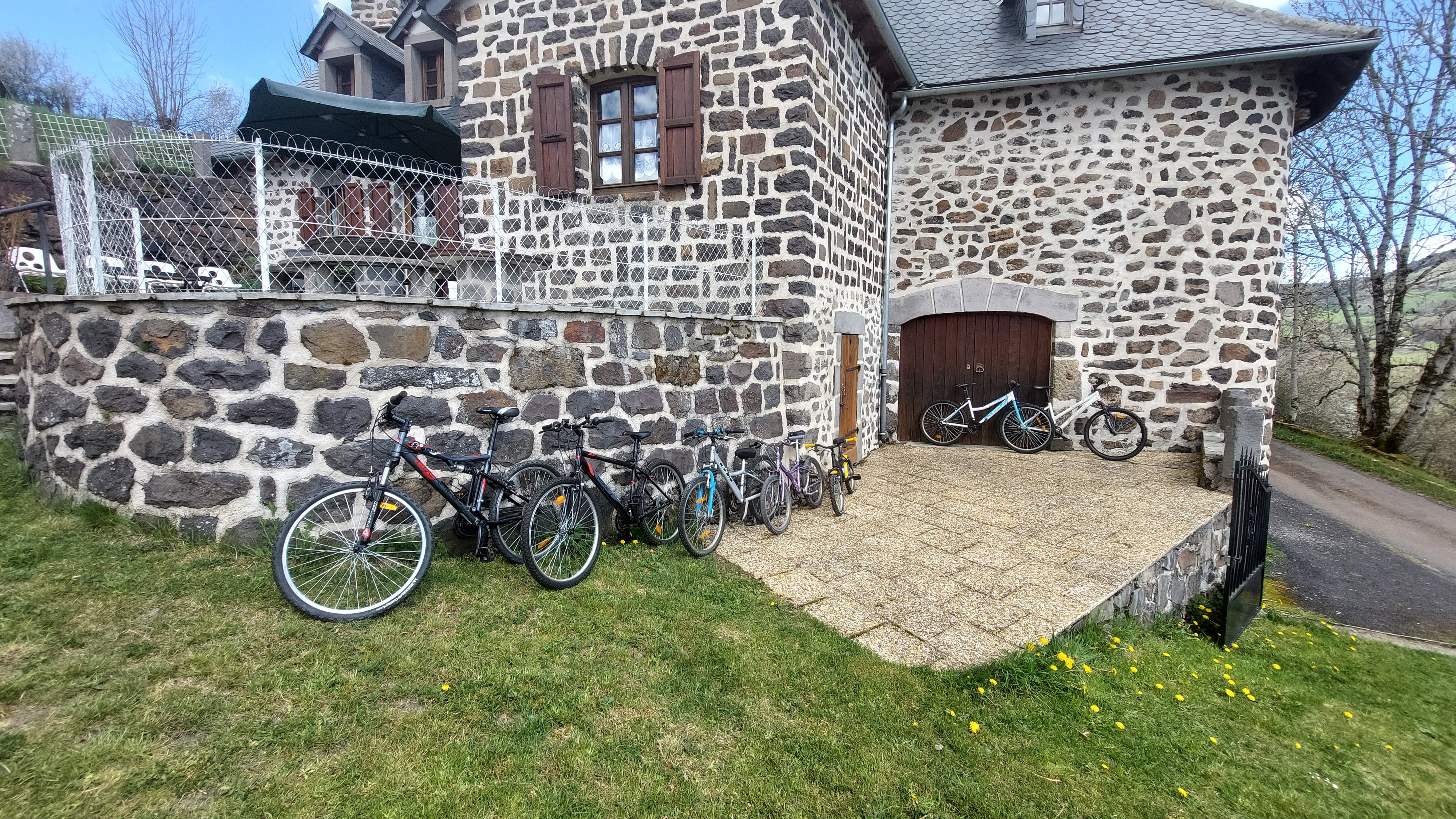stone house with bicycles family gîte Cantal