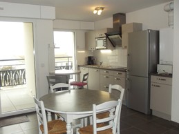 Dining area opening onto balcony