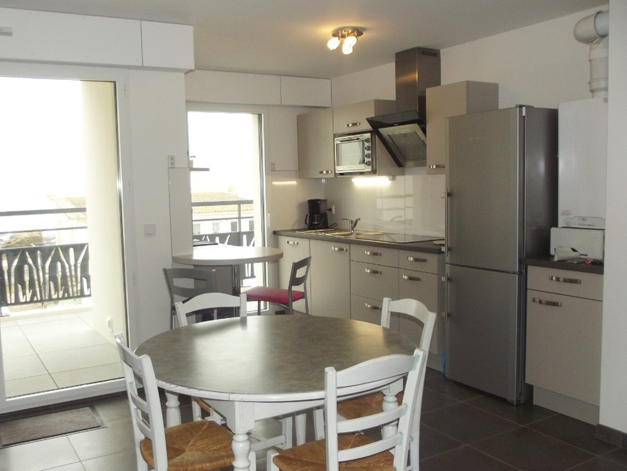 Dining area opening onto balcony