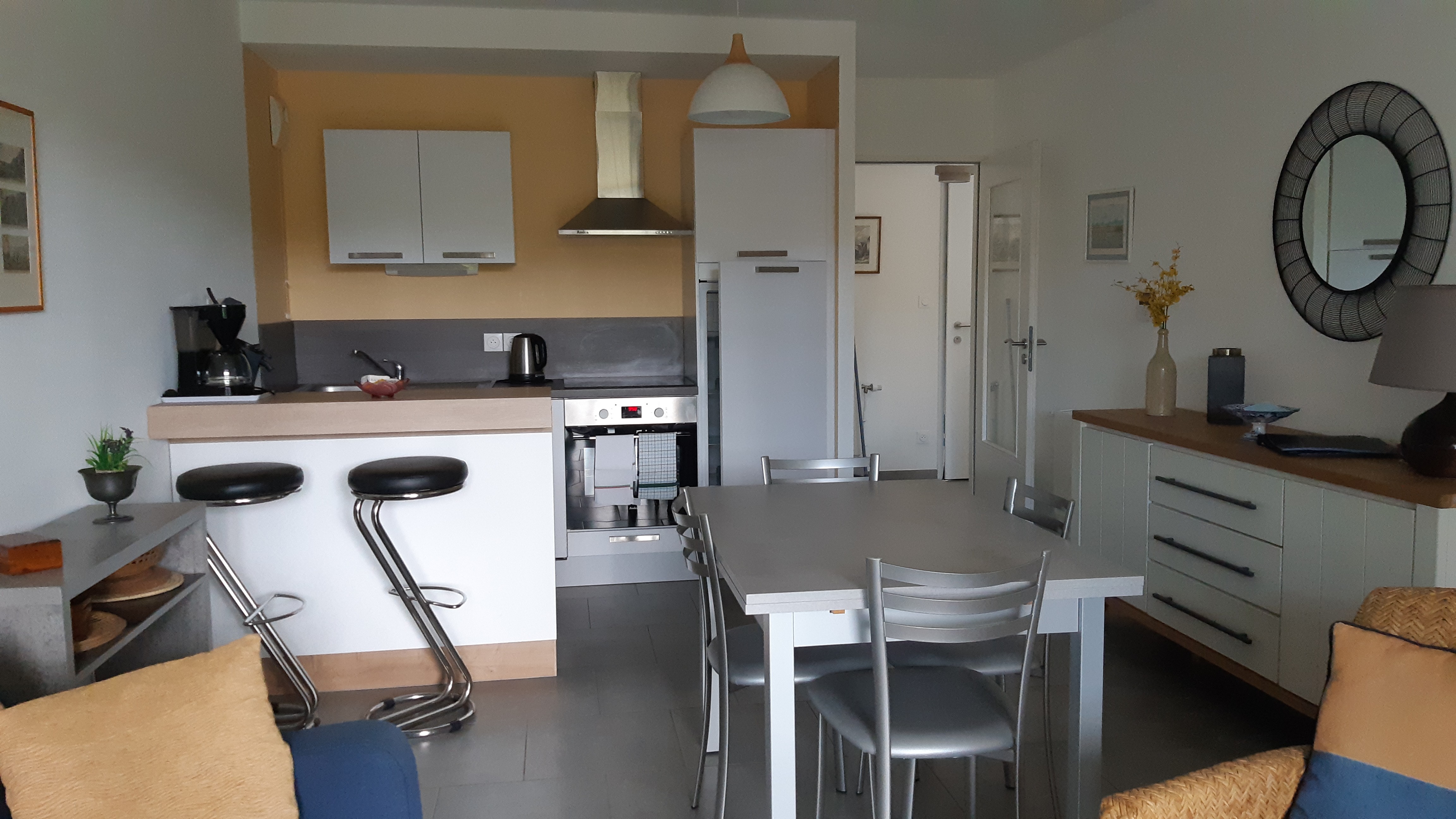 Kitchen opening onto living room