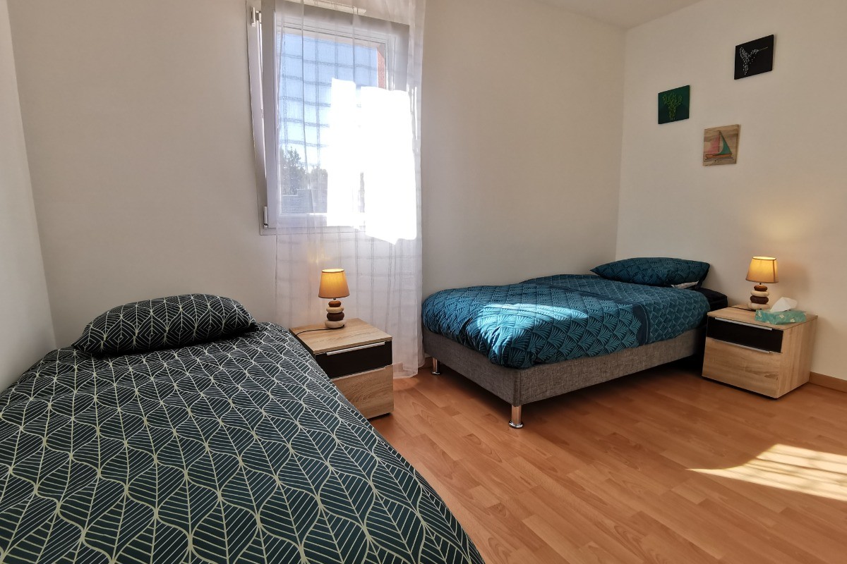 Chambre avec 2 lits 90