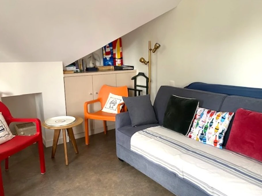 Studio with kitchenette on the left, comfortable convertible sofa bed 160 x 200 cm, dining table, desk, TV, storage space, private shower room and WC.