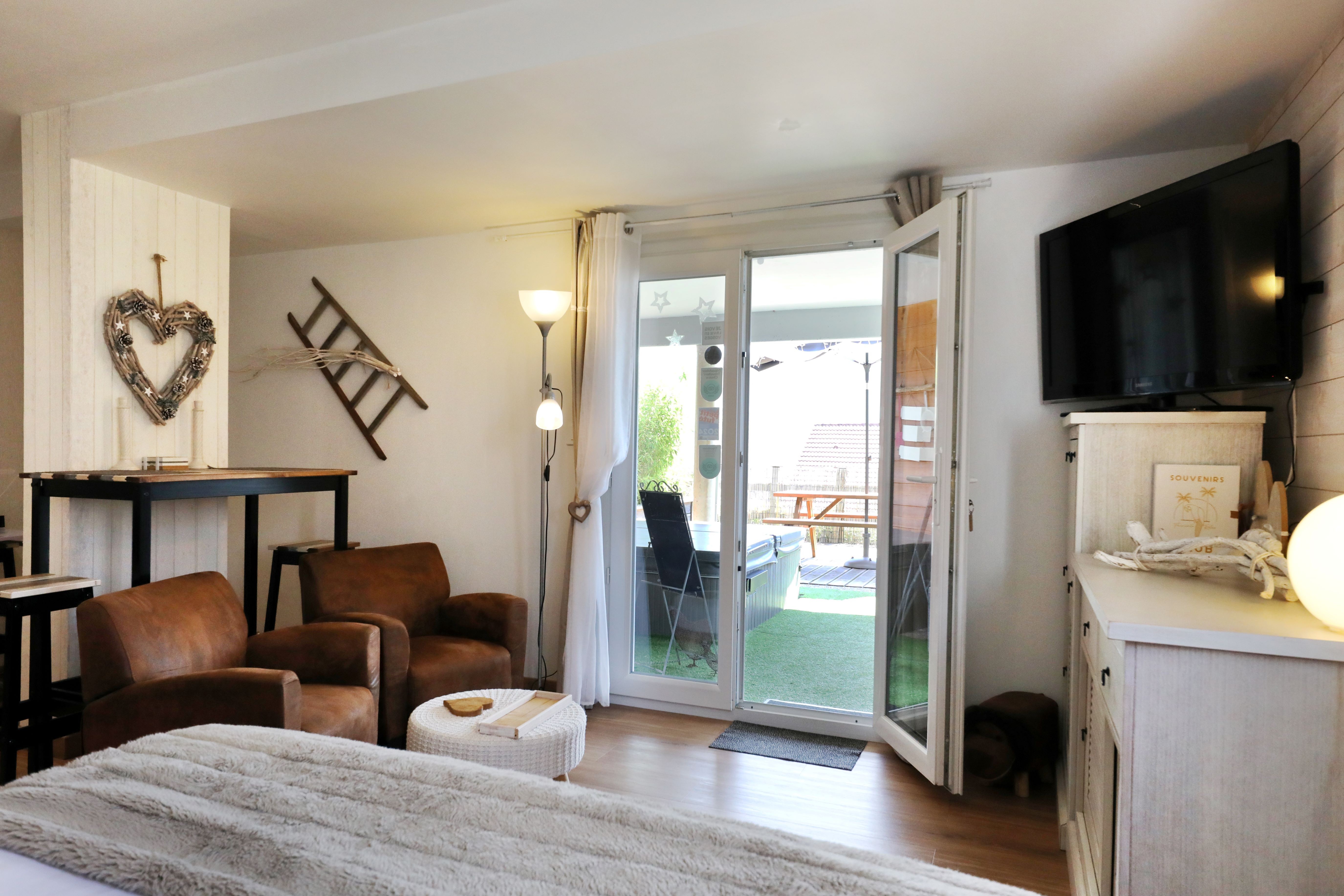 Espace salon  - Chambre cosy Le Nid Cosy d'Isa