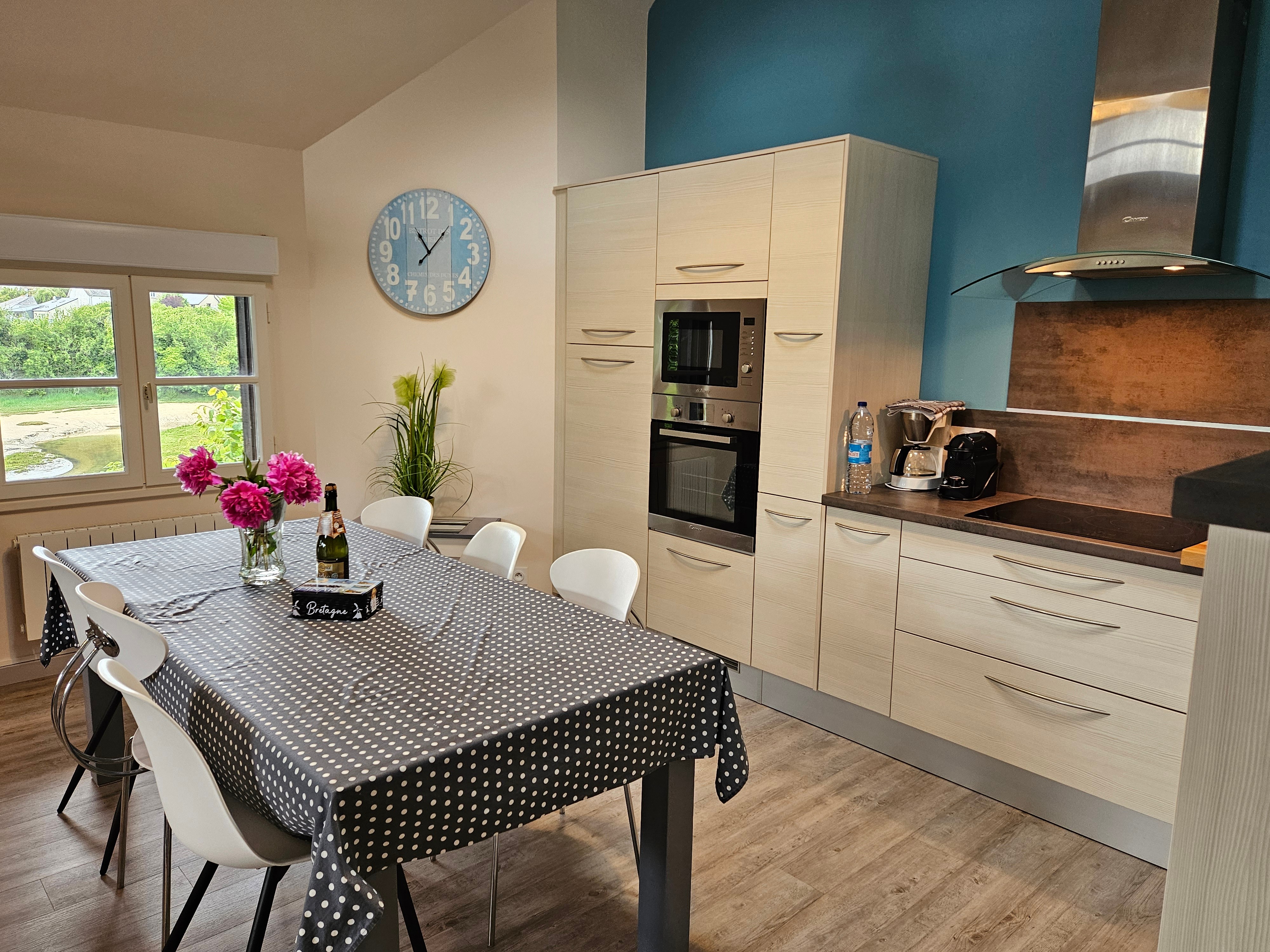 Living room with fitted kitchen, lounge and sitting area. Access to private terrace.