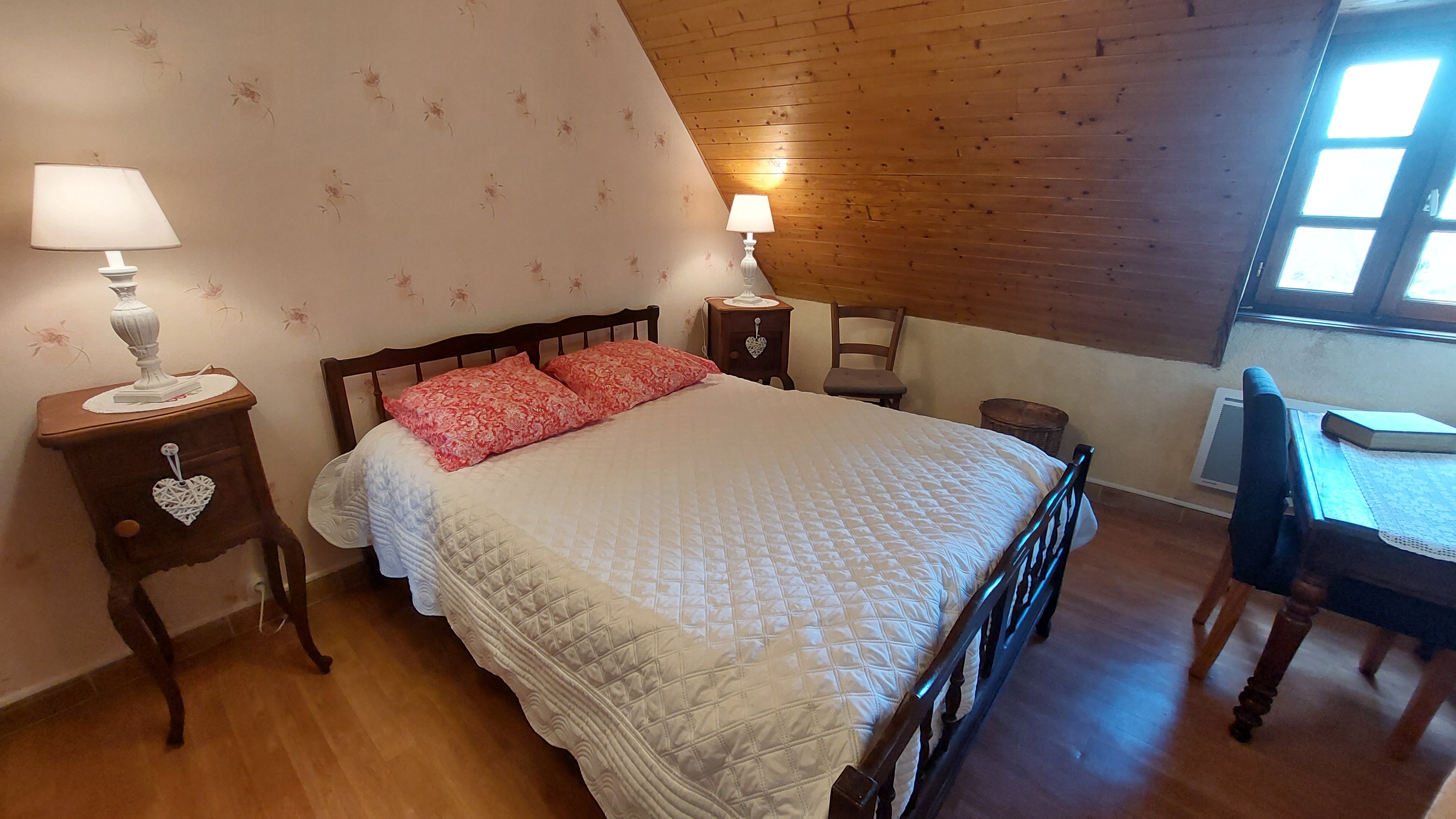 Bedroom with double bed and traditional Auvergne furniture