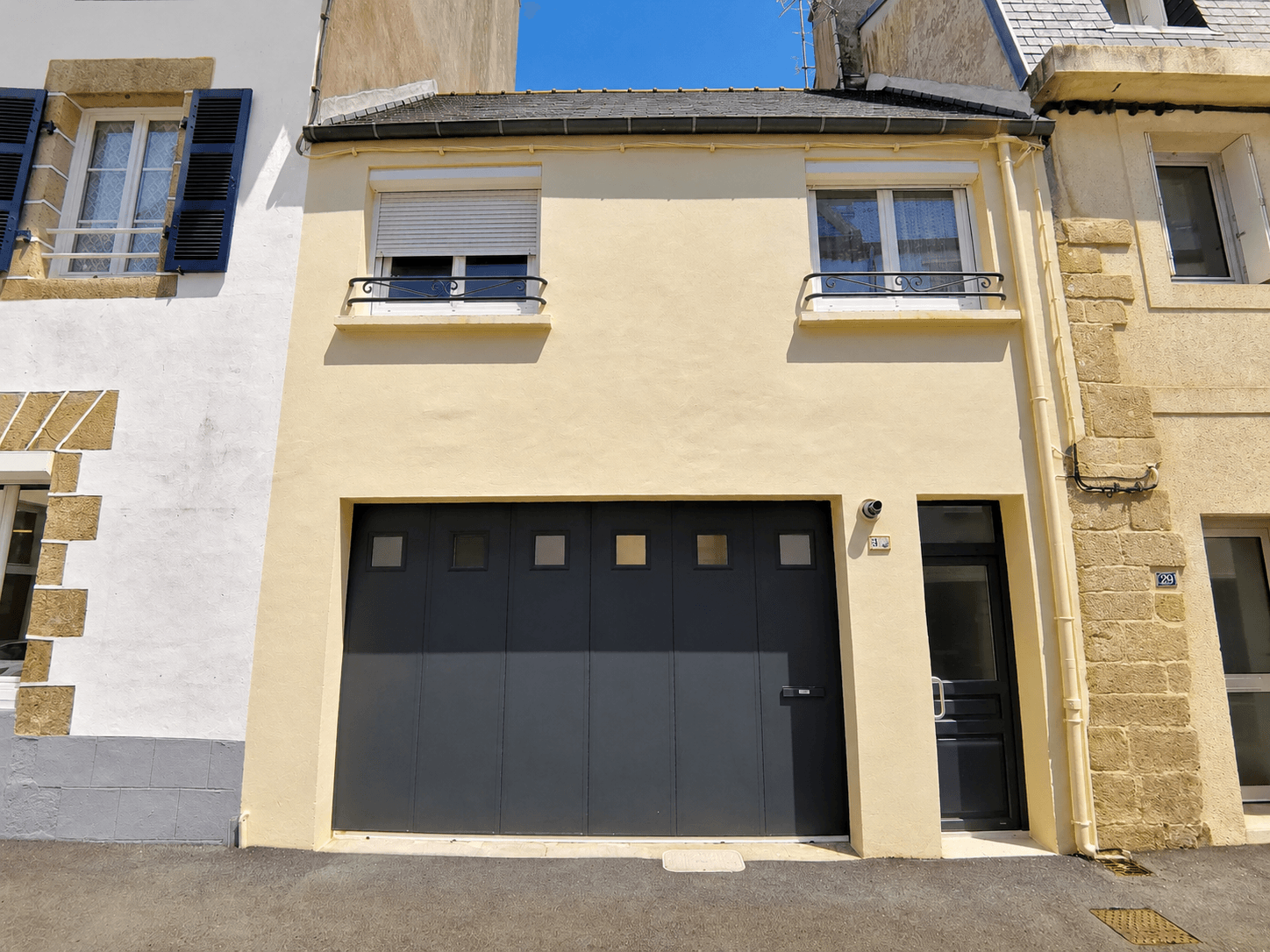 Entrance to the house in a small alley behind the port with 2-car garage