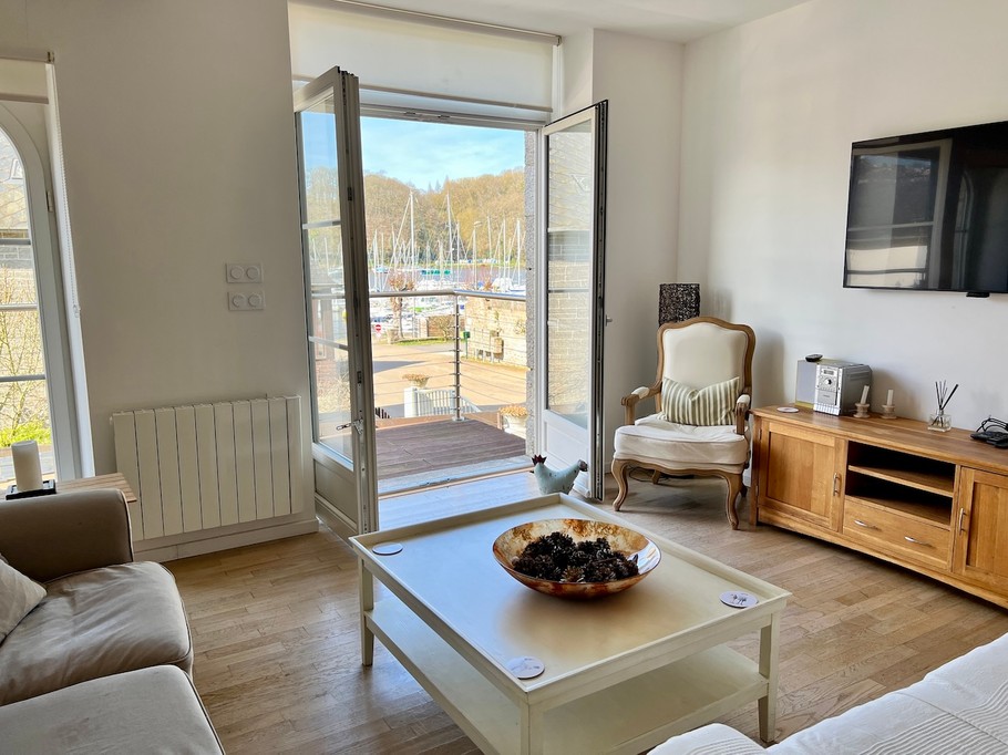 Spacious, bright open-plan living area with floor-to-ceiling windows