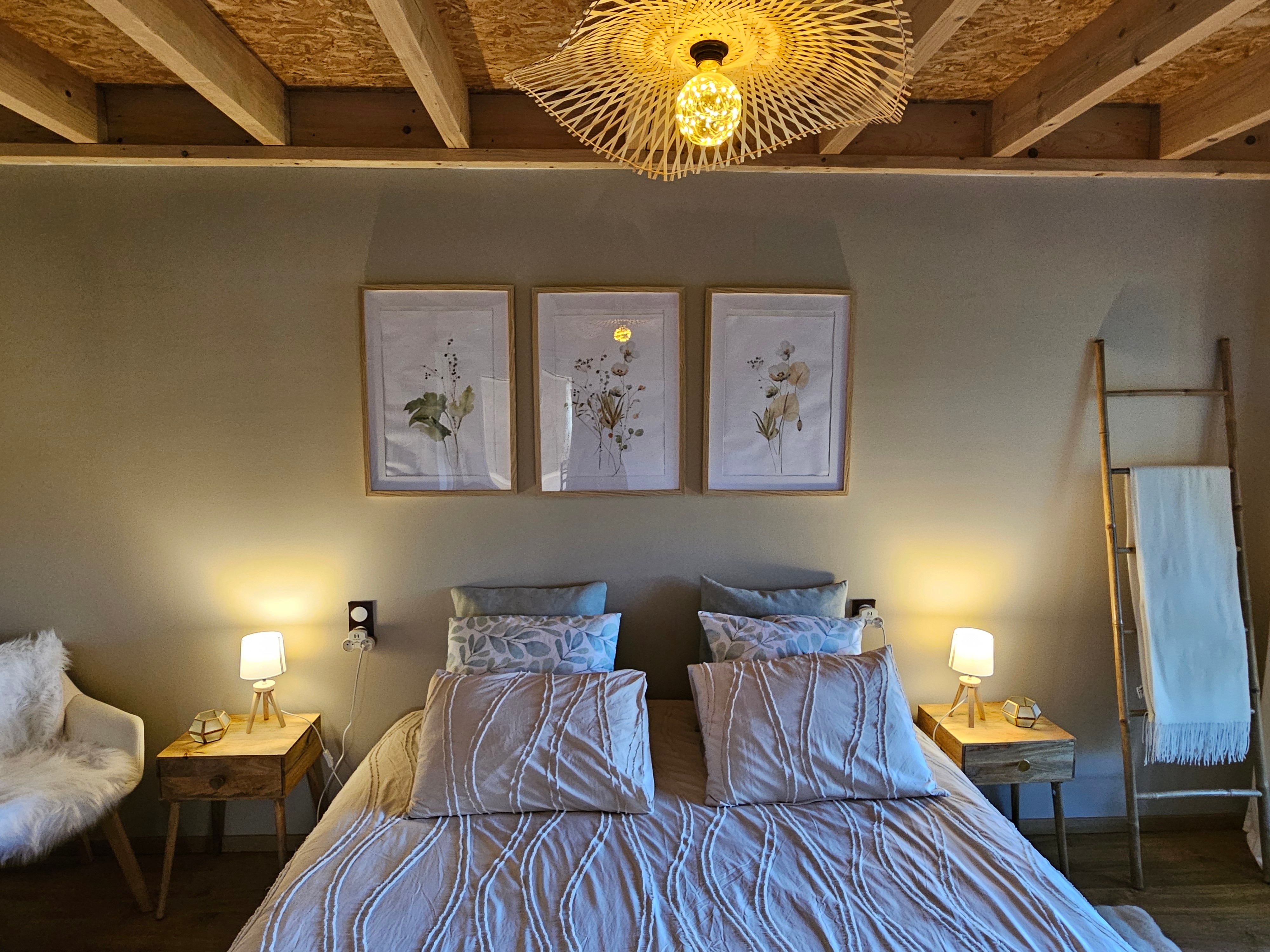 A large double bedroom with a walk-in wardrobe and a desk.